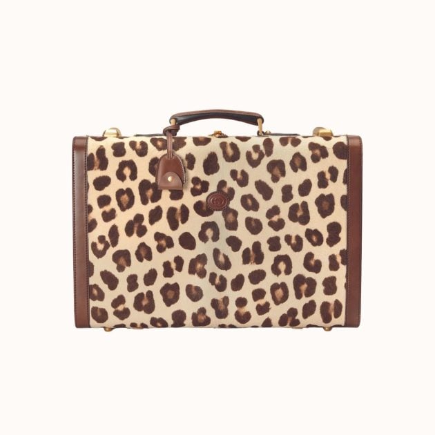 Leopard-print trunk suitcase with leather trim and handles