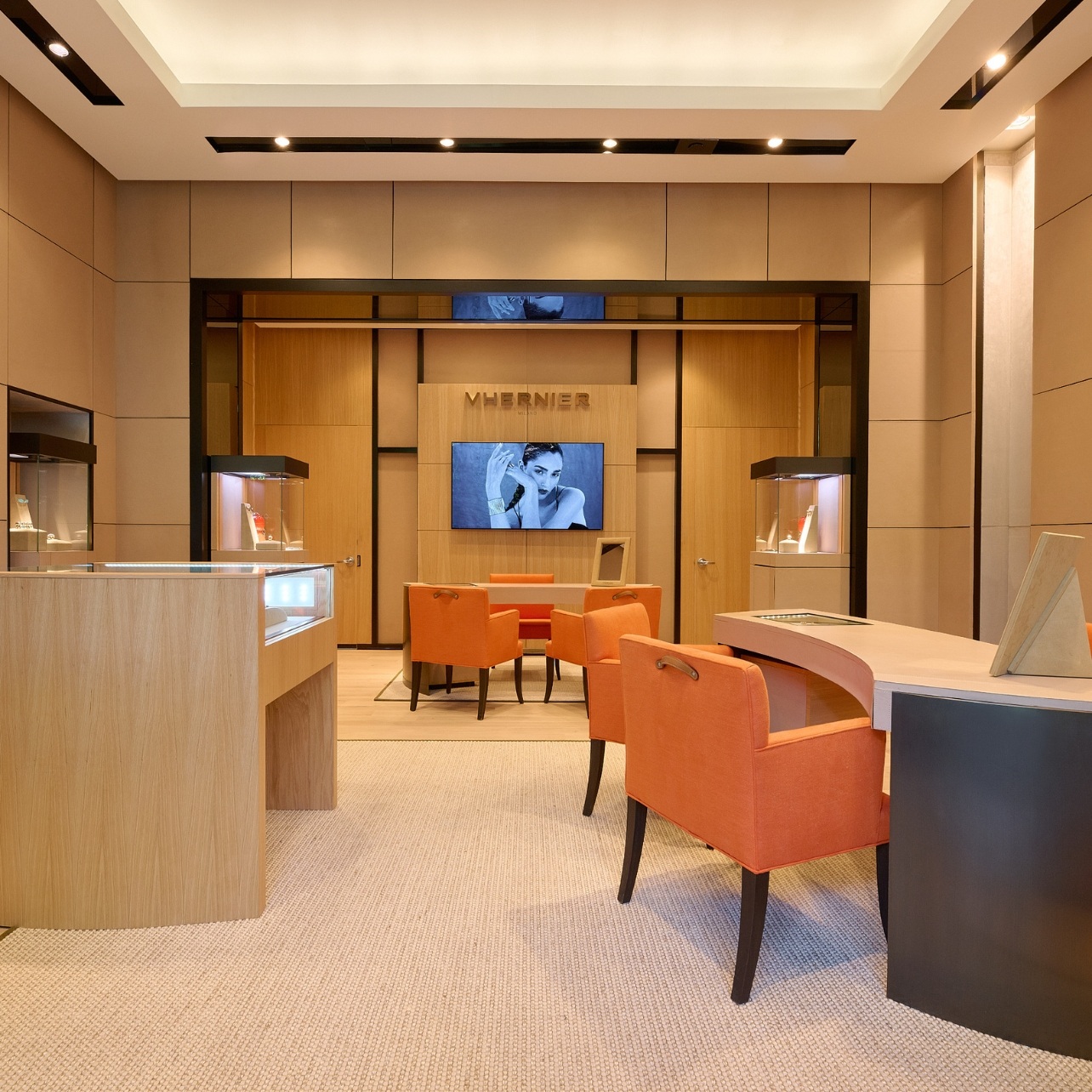 Image of Vhernier showcasing its interiors of light wood and orange furnishings