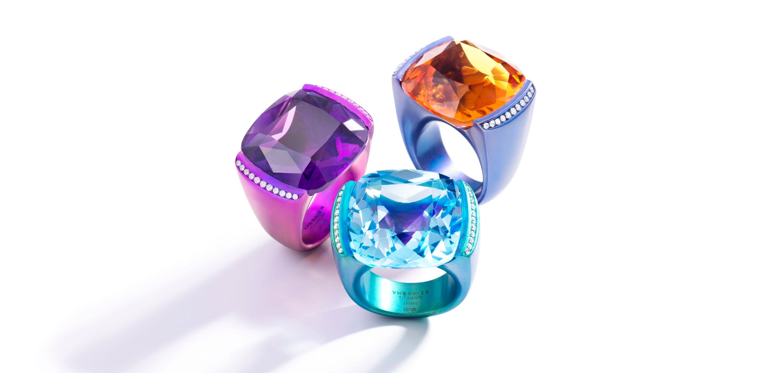 Trio of cocktails rings in purple, blue, and turquoise colored titanium and stones