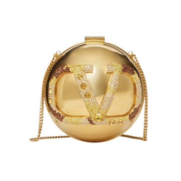 Image of gold Valentino round purse with rhinestone embellishments