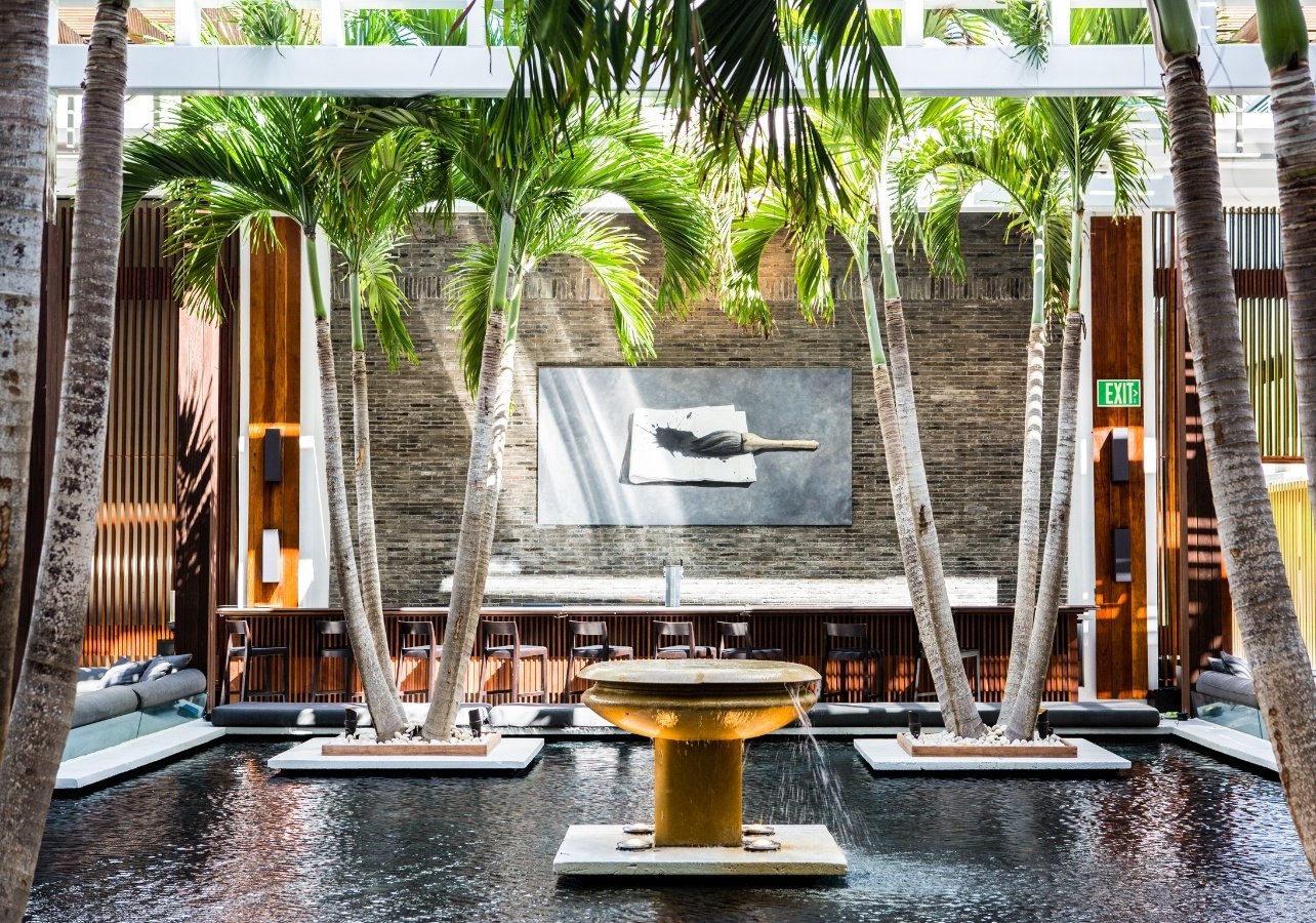 Setai courtyard with palm trees and shallow water pools