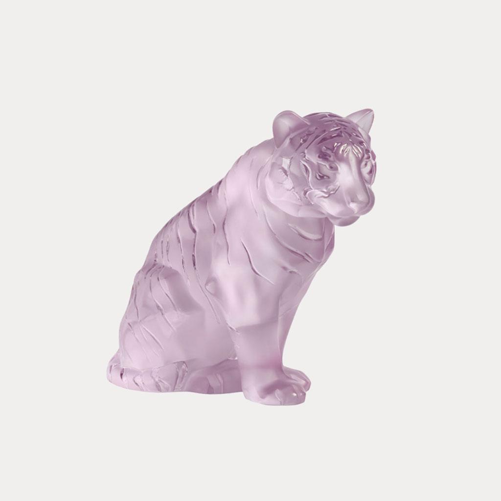 Limited to an edition of just 288, Lalique’s sitting crystal tiger sculpture in pink is emblematic of bravery, pride, grace, and vibrant feminine energy.                                                                                                                                                                                                      