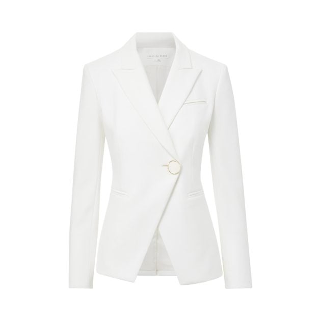 Photo of a white single-breasted blazer with an oversized gold statement button