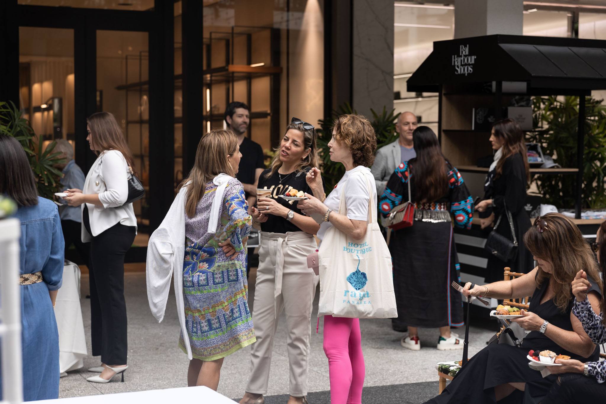 A variety of images showcasing the event with Raymond Jungles. Images include guests in attendance, event décor, and brunch bites provided by Le Zoo.