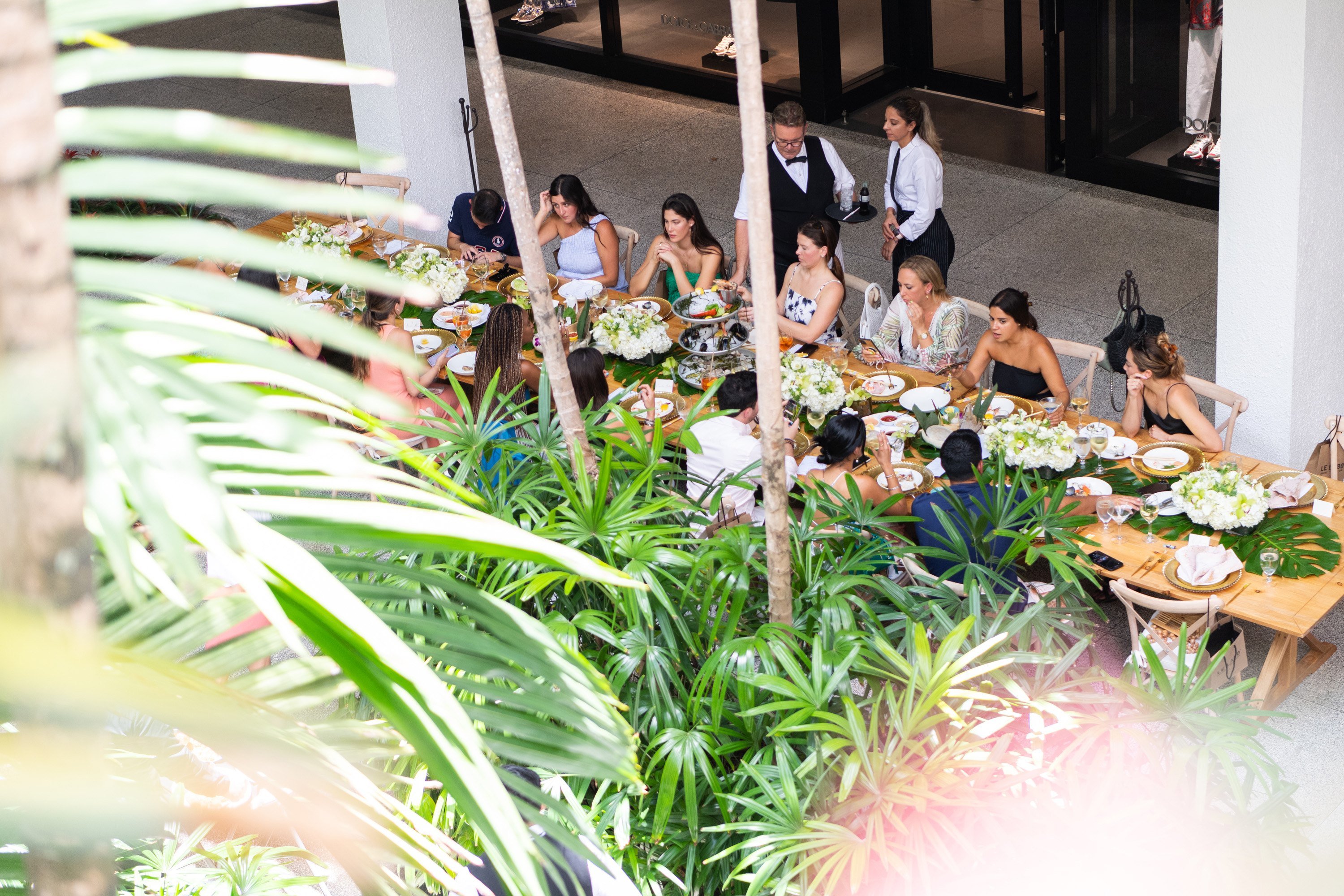A variety of images showcasing “A Taste of Bal Harbour Shops”. Images include guests in attendance, table décor, and food featured at the event.