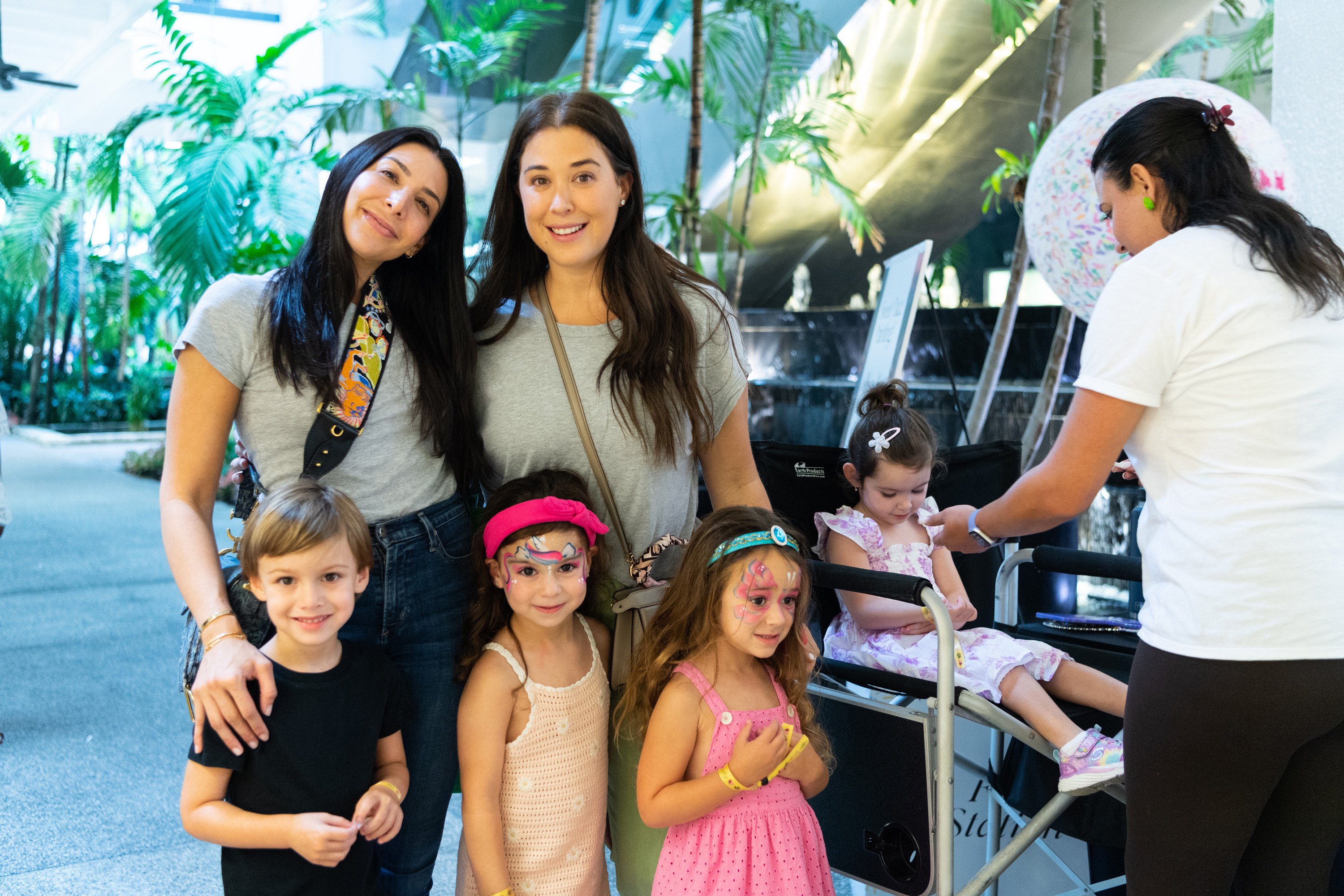 A variety of images showcasing the fourth annual “Ice Cream We Love” event. Images include guests in attendance, ice cream treats and setup, and activities featured at the event including games, face painting, and performances.