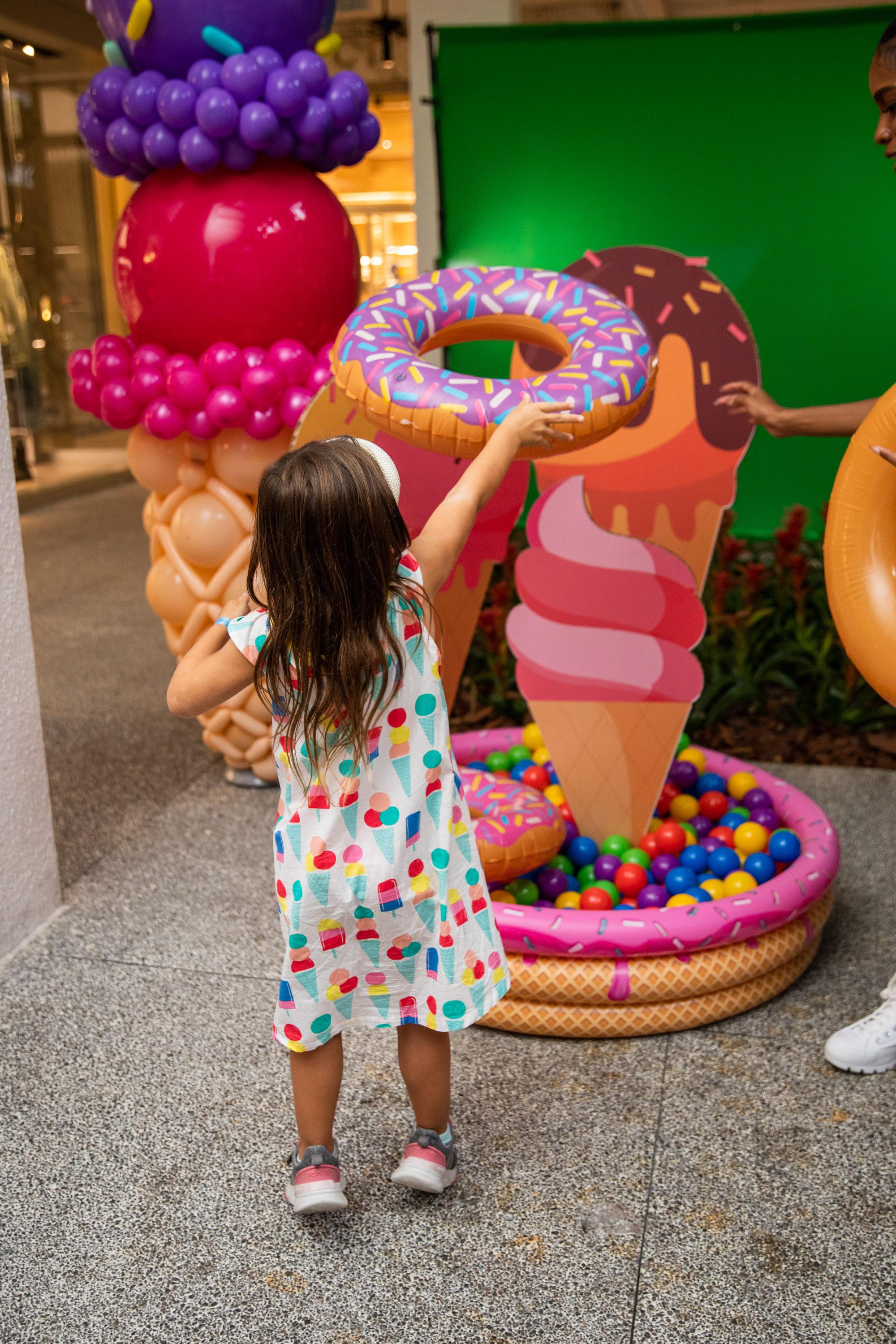 A variety of images showcasing the fourth annual “Ice Cream We Love” event. Images include guests in attendance, ice cream treats and setup, and activities featured at the event including games, face painting, and performances.