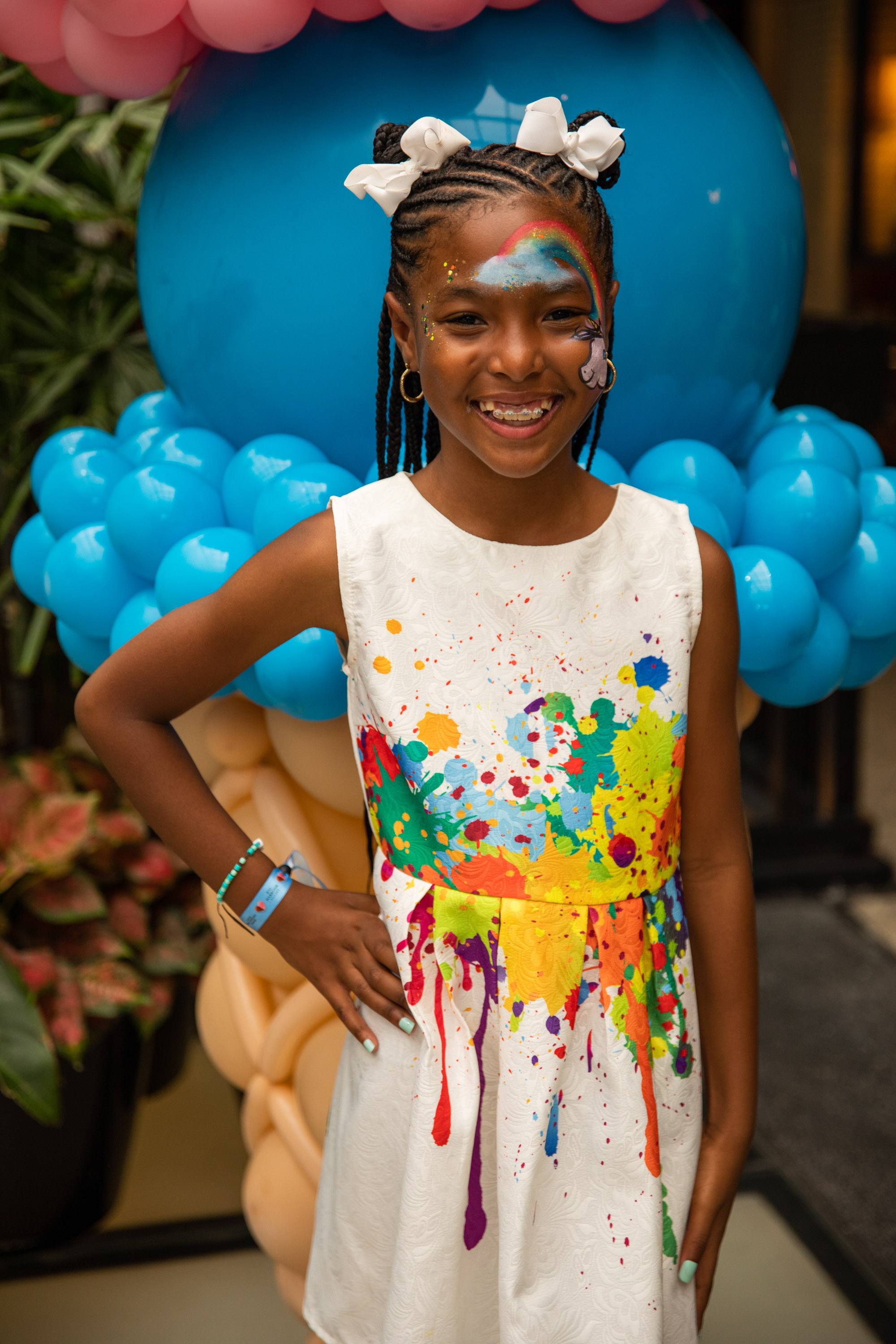 A variety of images showcasing the fourth annual “Ice Cream We Love” event. Images include guests in attendance, ice cream treats and setup, and activities featured at the event including games, face painting, and performances.