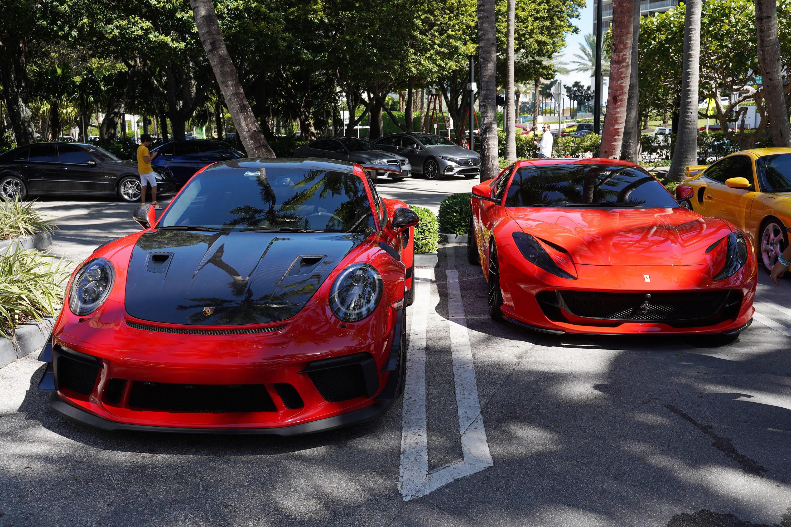 A variety of images showcasing the Collector’s Car Show hosted by Bal Harbour Shops during Bespoke Bal Harbour. Images include guests in attendance, rare and exotic cars showcased at the event, and watched from Richard Mille.