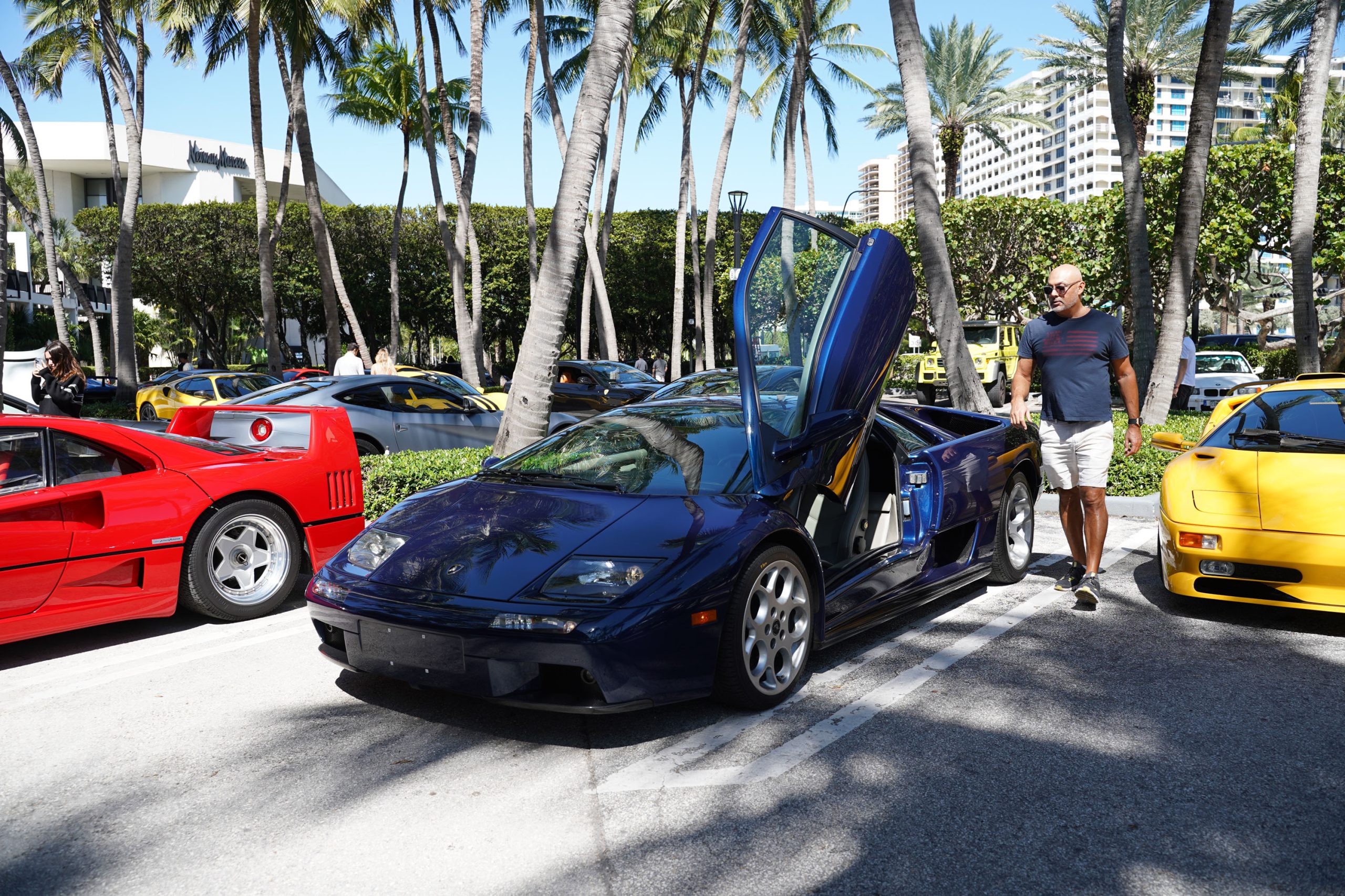 A variety of images showcasing the Collector’s Car Show hosted by Bal Harbour Shops during Bespoke Bal Harbour. Images include guests in attendance, rare and exotic cars showcased at the event, and watched from Richard Mille.