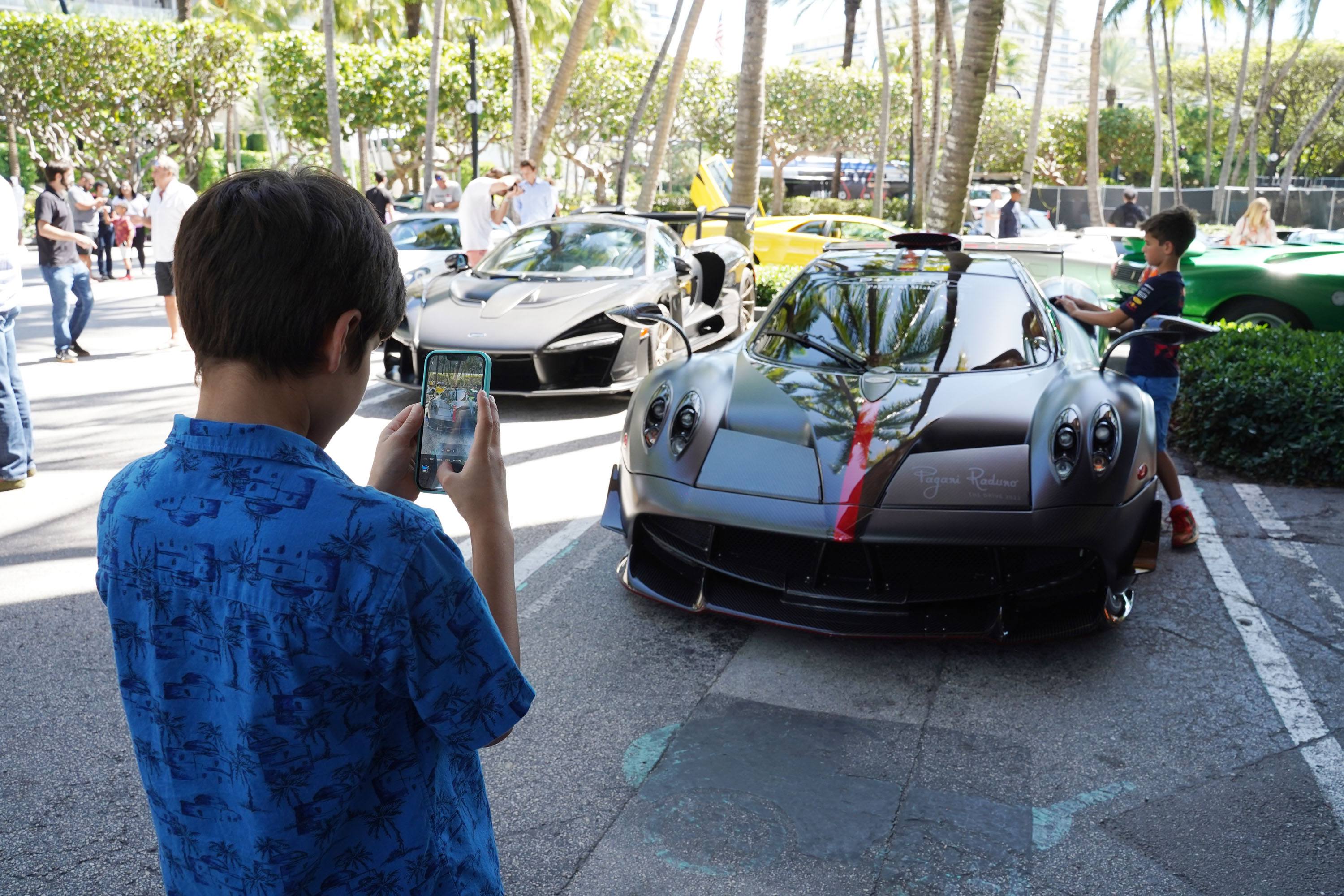 A variety of images showcasing the Collector’s Car Show hosted by Bal Harbour Shops during Bespoke Bal Harbour. Images include guests in attendance, rare and exotic cars showcased at the event, and watched from Richard Mille.