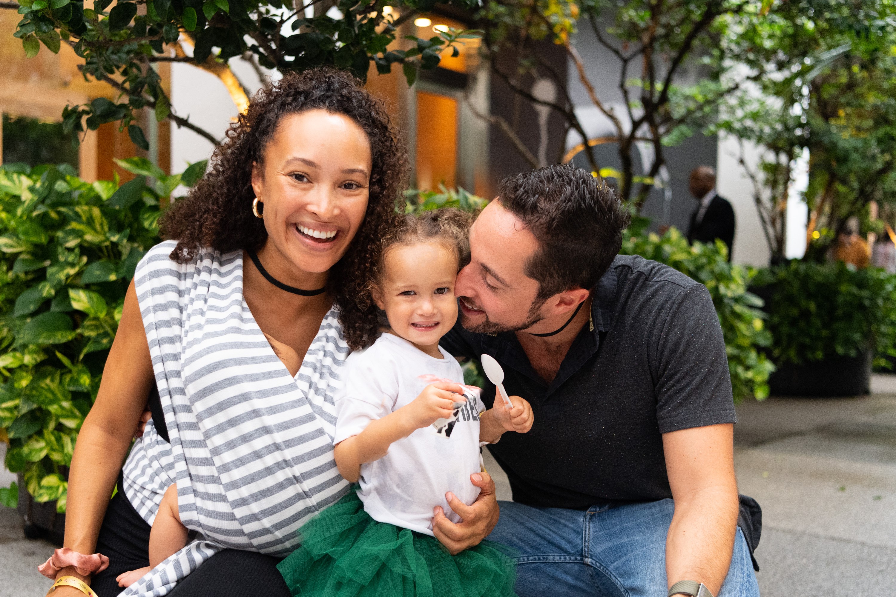 A variety of images showcasing the fourth annual “Ice Cream We Love” event. Images include guests in attendance, ice cream treats and setup, and activities featured at the event including games, face painting, and performances.