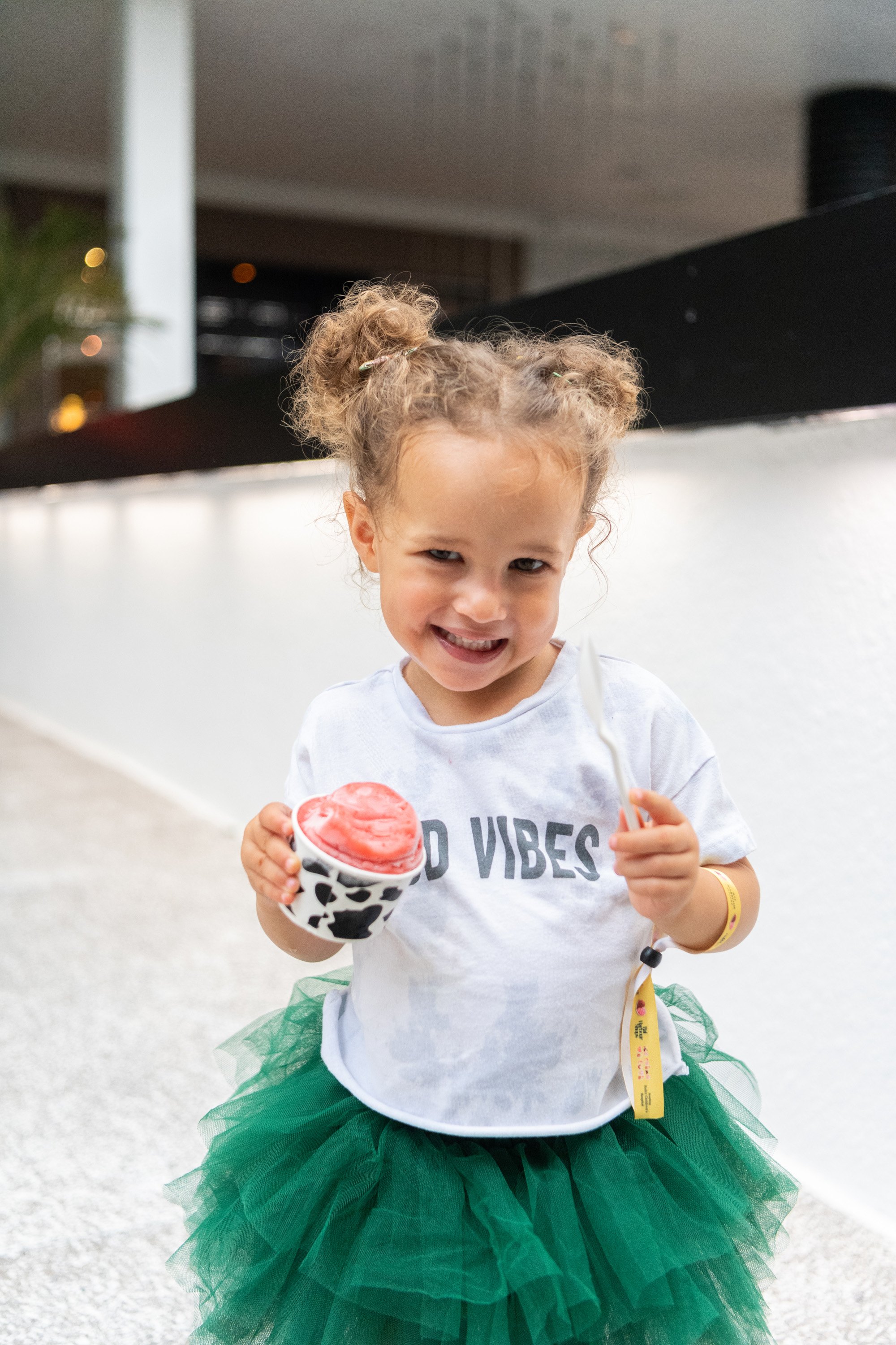 A variety of images showcasing the fourth annual “Ice Cream We Love” event. Images include guests in attendance, ice cream treats and setup, and activities featured at the event including games, face painting, and performances.