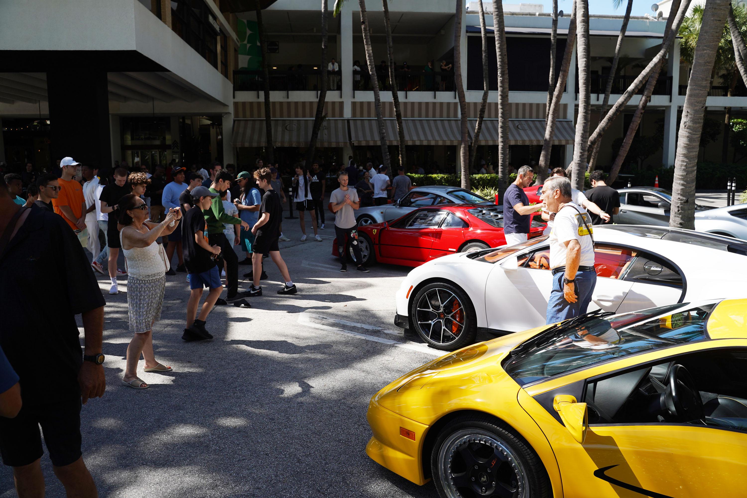 A variety of images showcasing the Collector’s Car Show hosted by Bal Harbour Shops during Bespoke Bal Harbour. Images include guests in attendance, rare and exotic cars showcased at the event, and watched from Richard Mille.