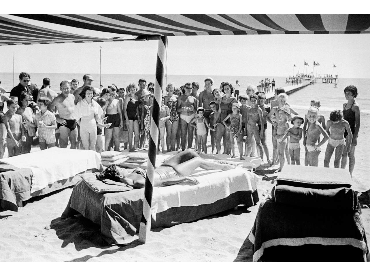 Black and white portrait of a woman sunbathing at the Venice Film Festival