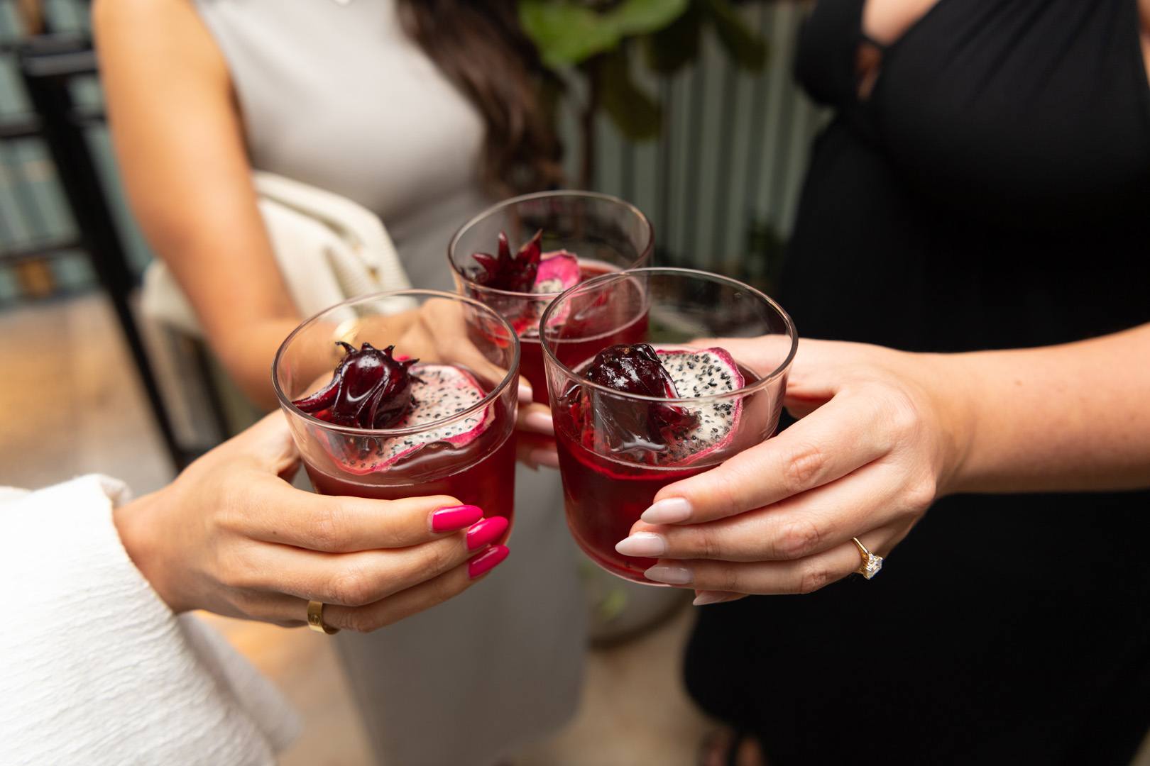 Guests cheersing their cocktails