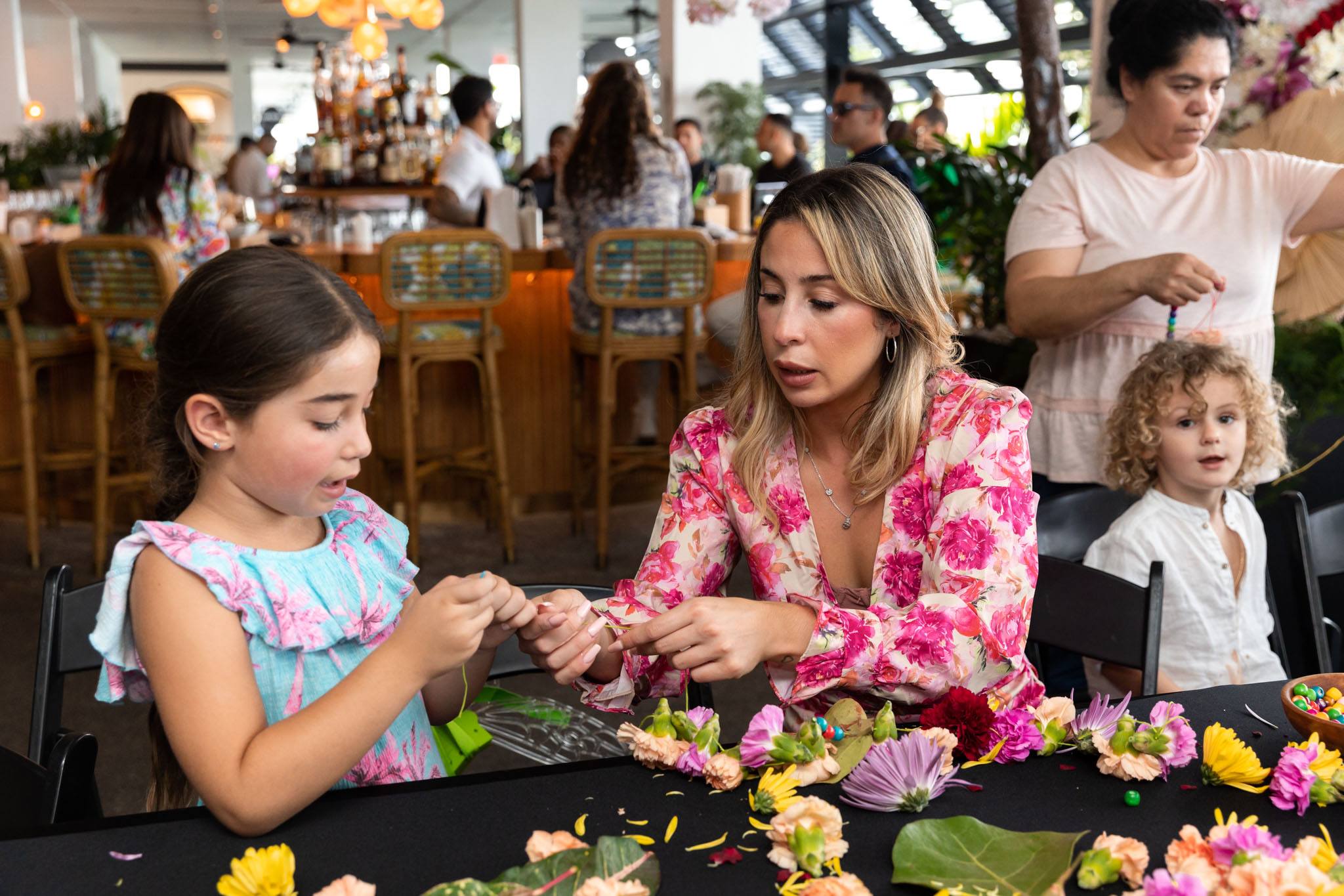 Mother and daughter making a floral lay