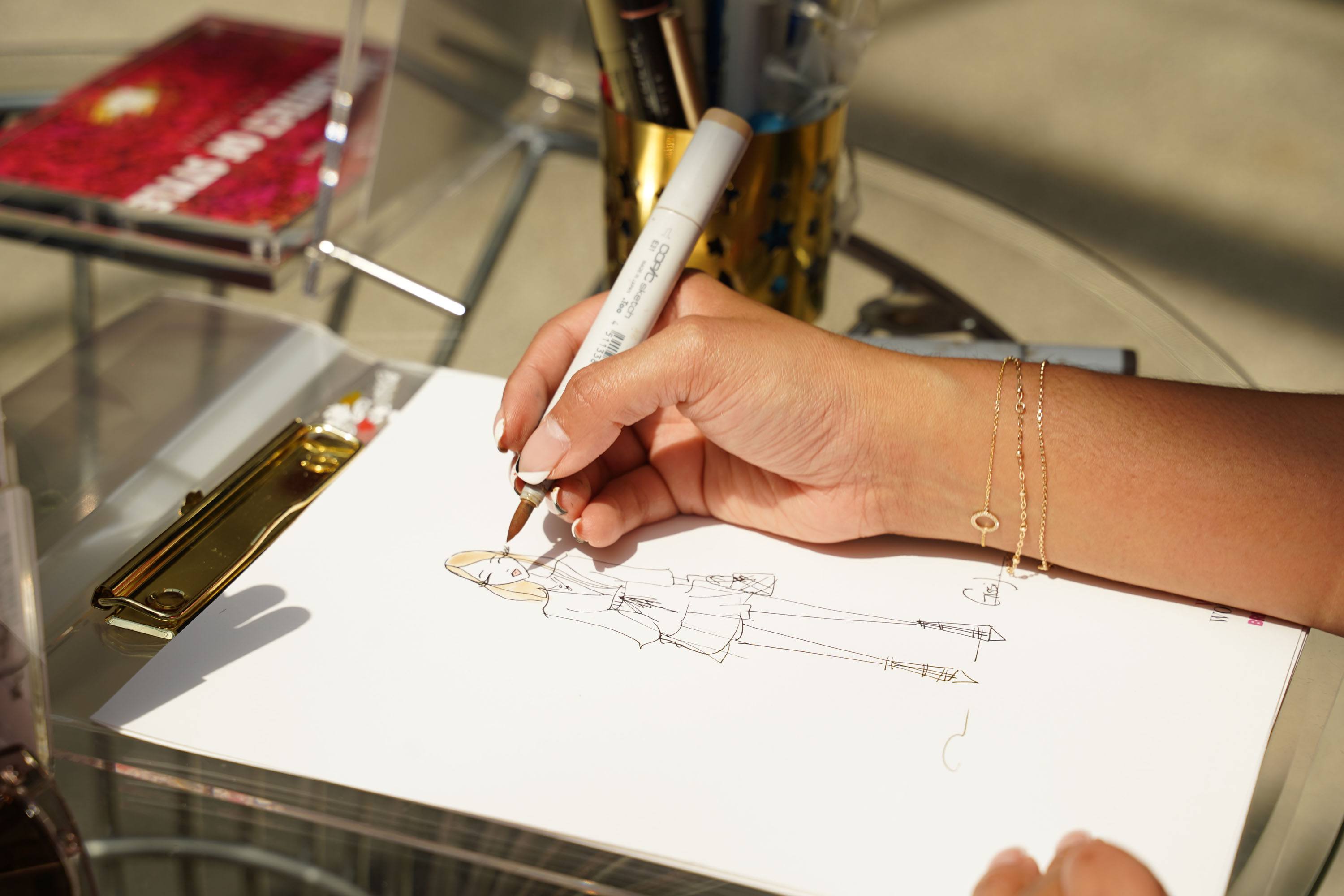 Artist sketching a portrait of guests