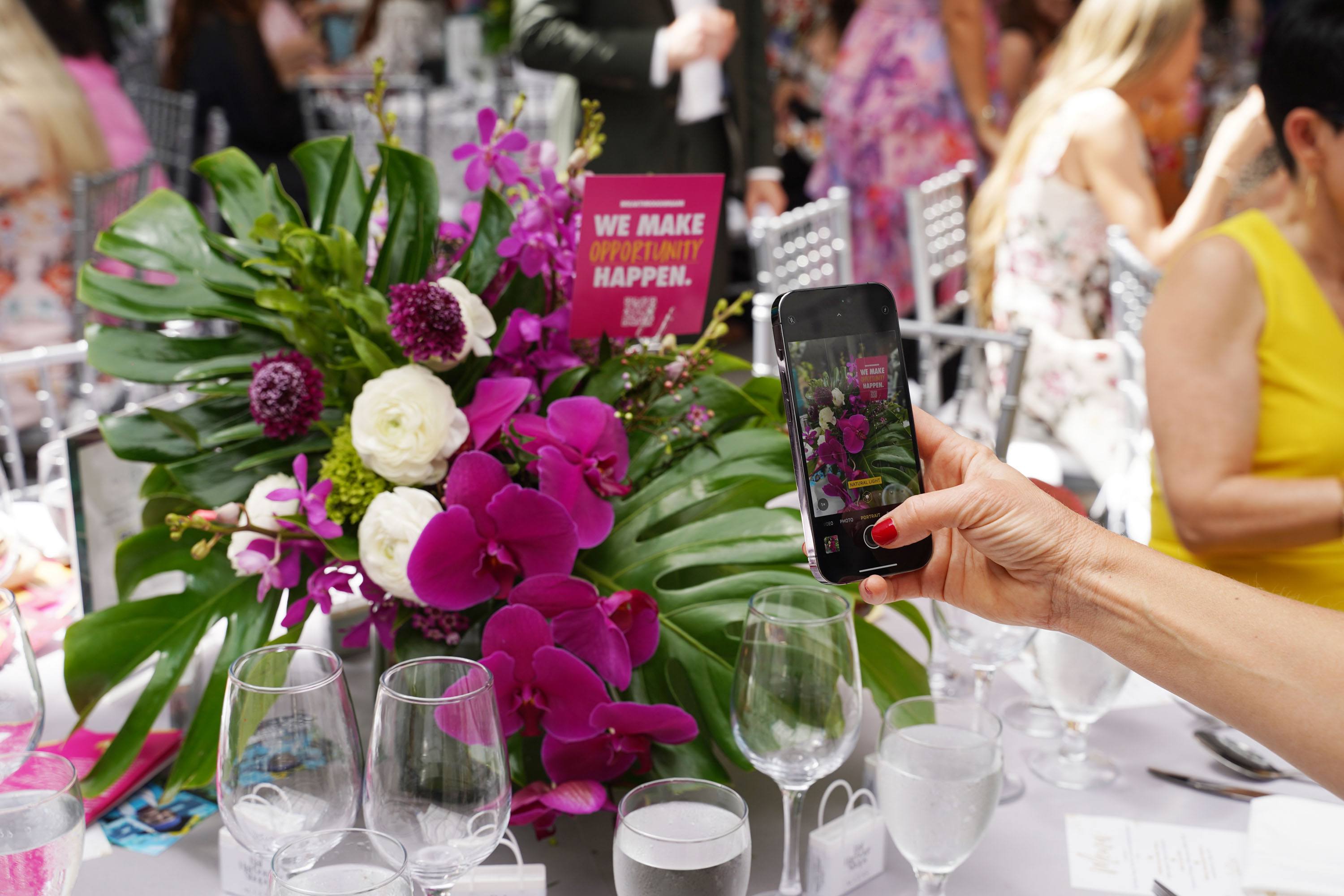 Guest taking pictures of the floral arrangements