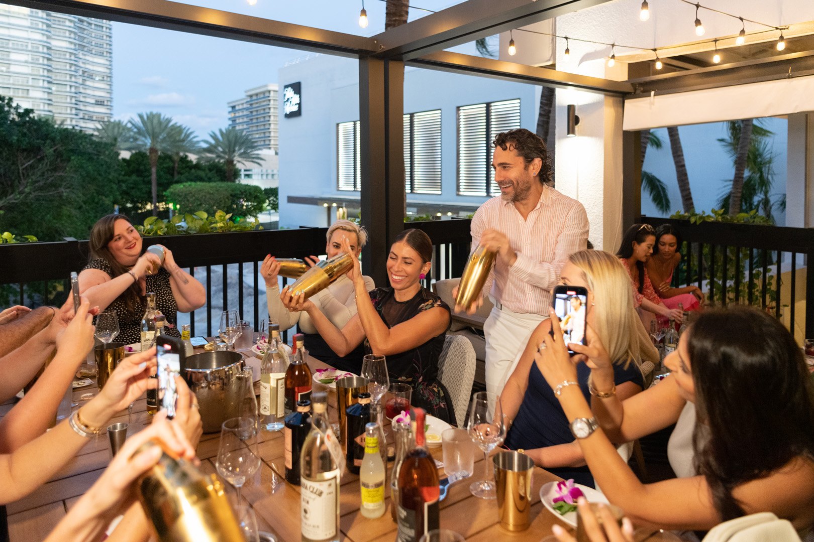 Gio Gutierrez showing guests how to make cocktails