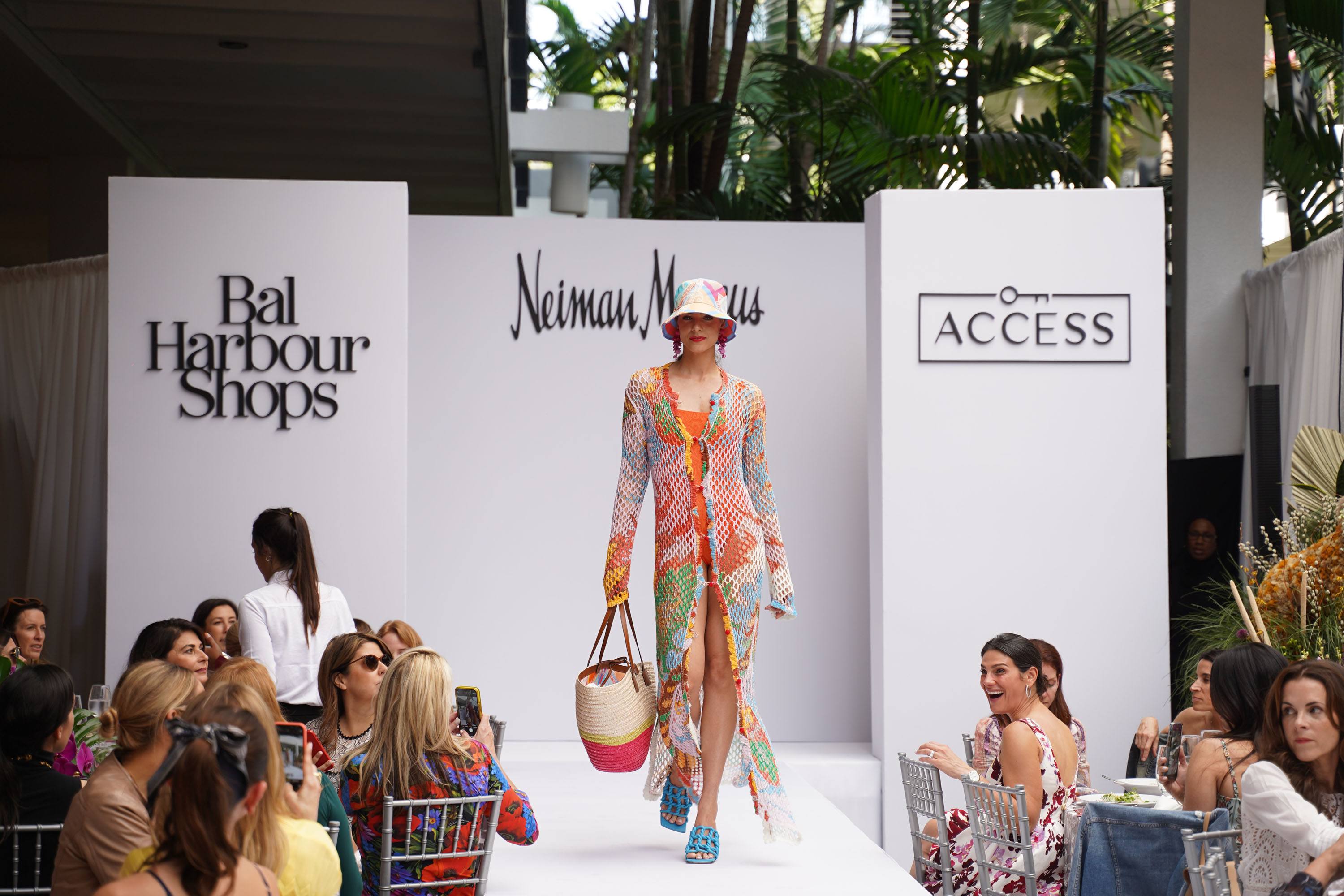 Model walking down runway dressed by Neiman Marcus