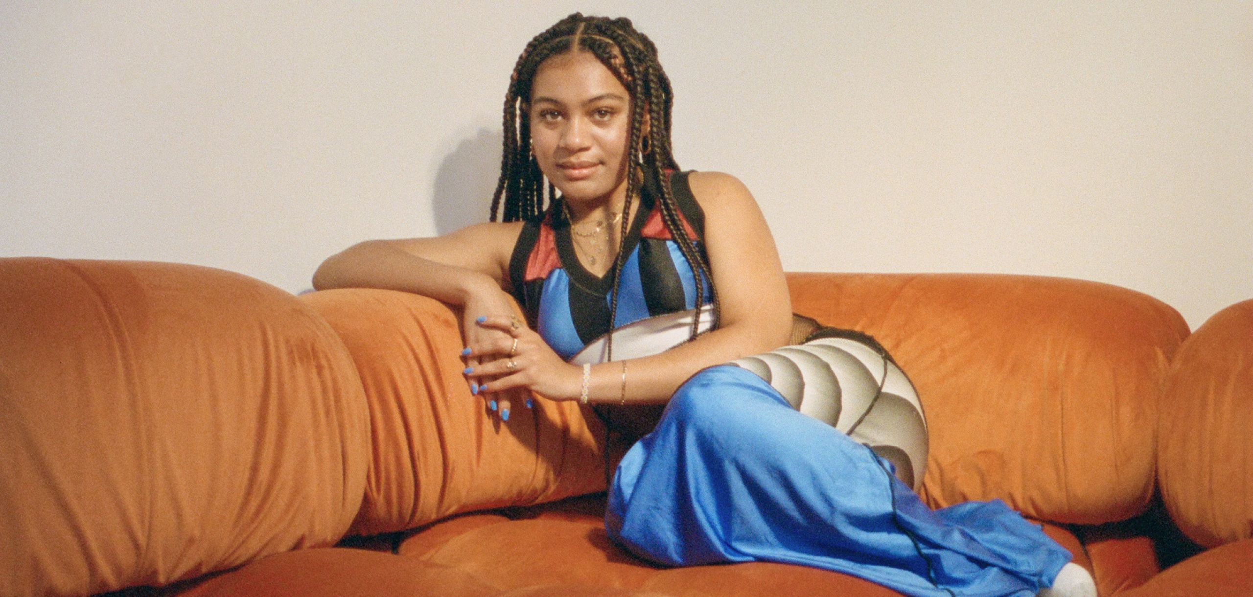 Sophia Wilson portrait on couch taken by Paul Hill