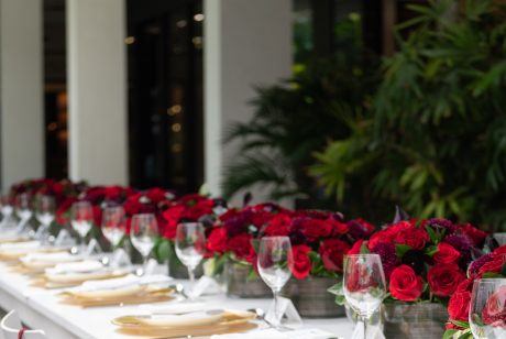 Bally luncheon table adorned with roses and Bally gift bags