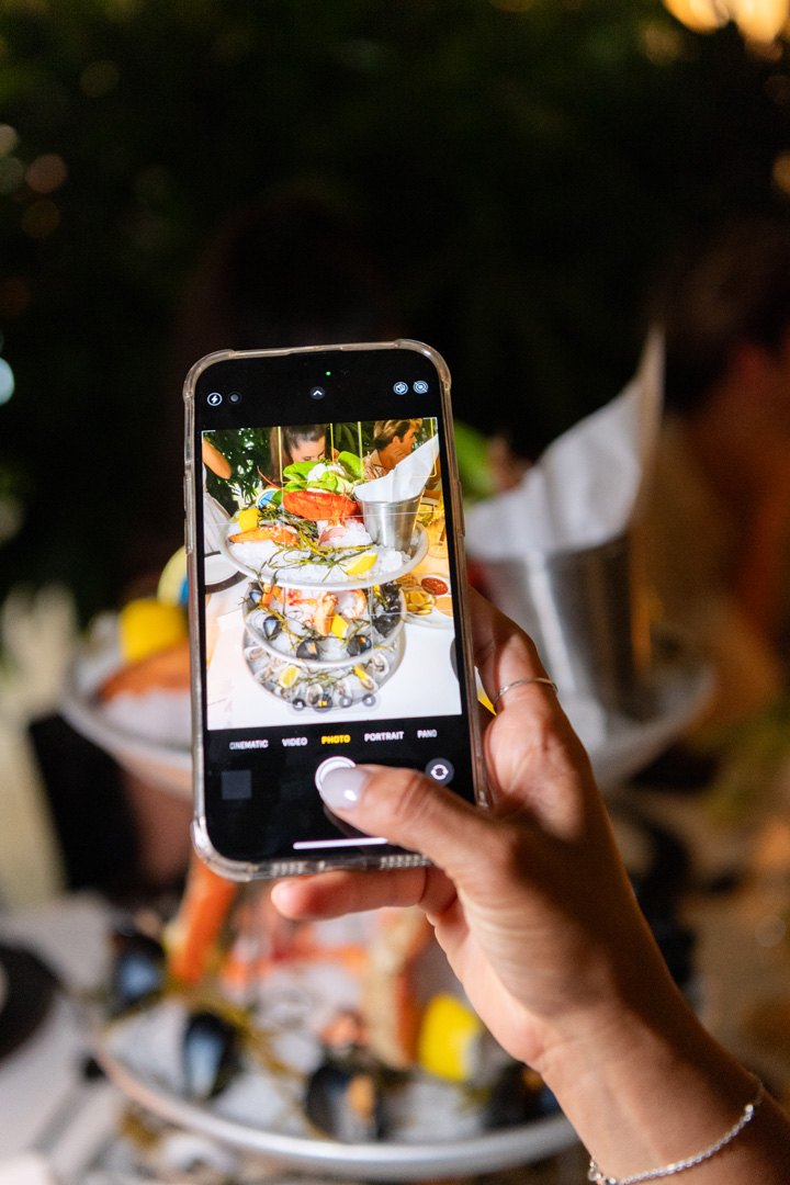 Guests taking photos of Makoto's Sashimi Platter