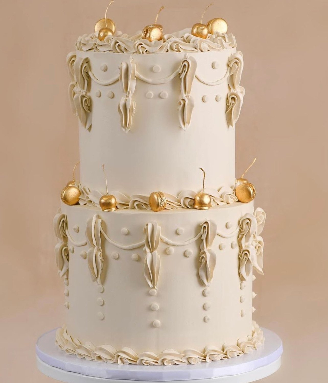 2-tier classic vintage style cake in muted tones with hints of gold