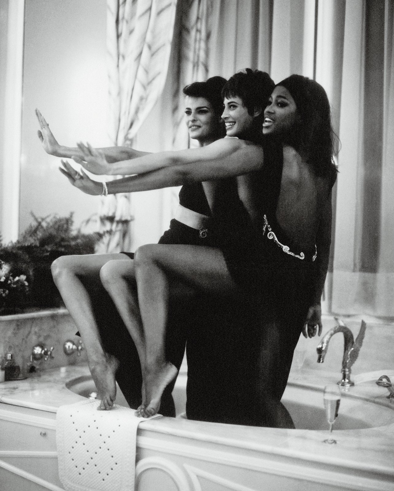 Linda Evangelista, Christy Turlington, Naomi Campbell, Atelier Versace after-show celebration at Donatella Versace’s hotel room, Ritz Paris July 1990