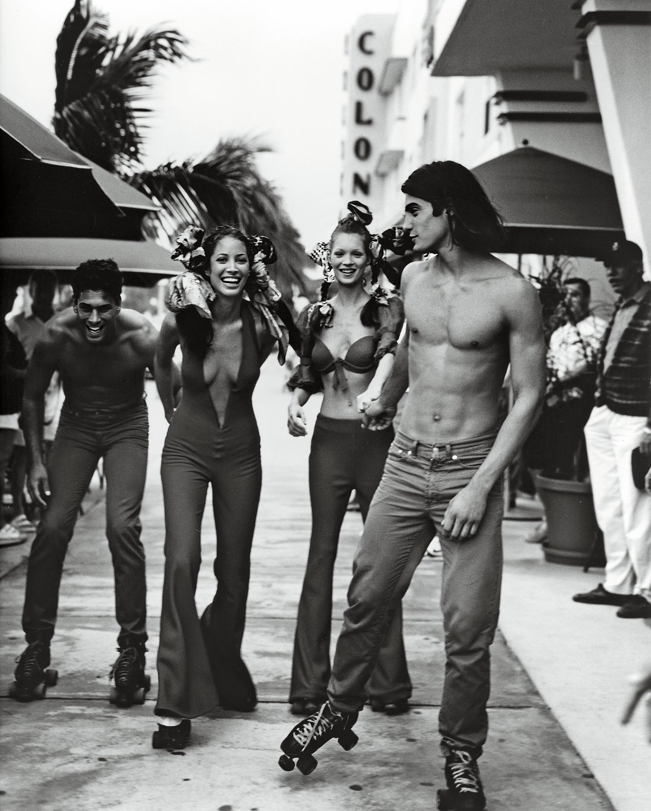 Models roller blading down South Beach in Versace for “South Beach Stories”