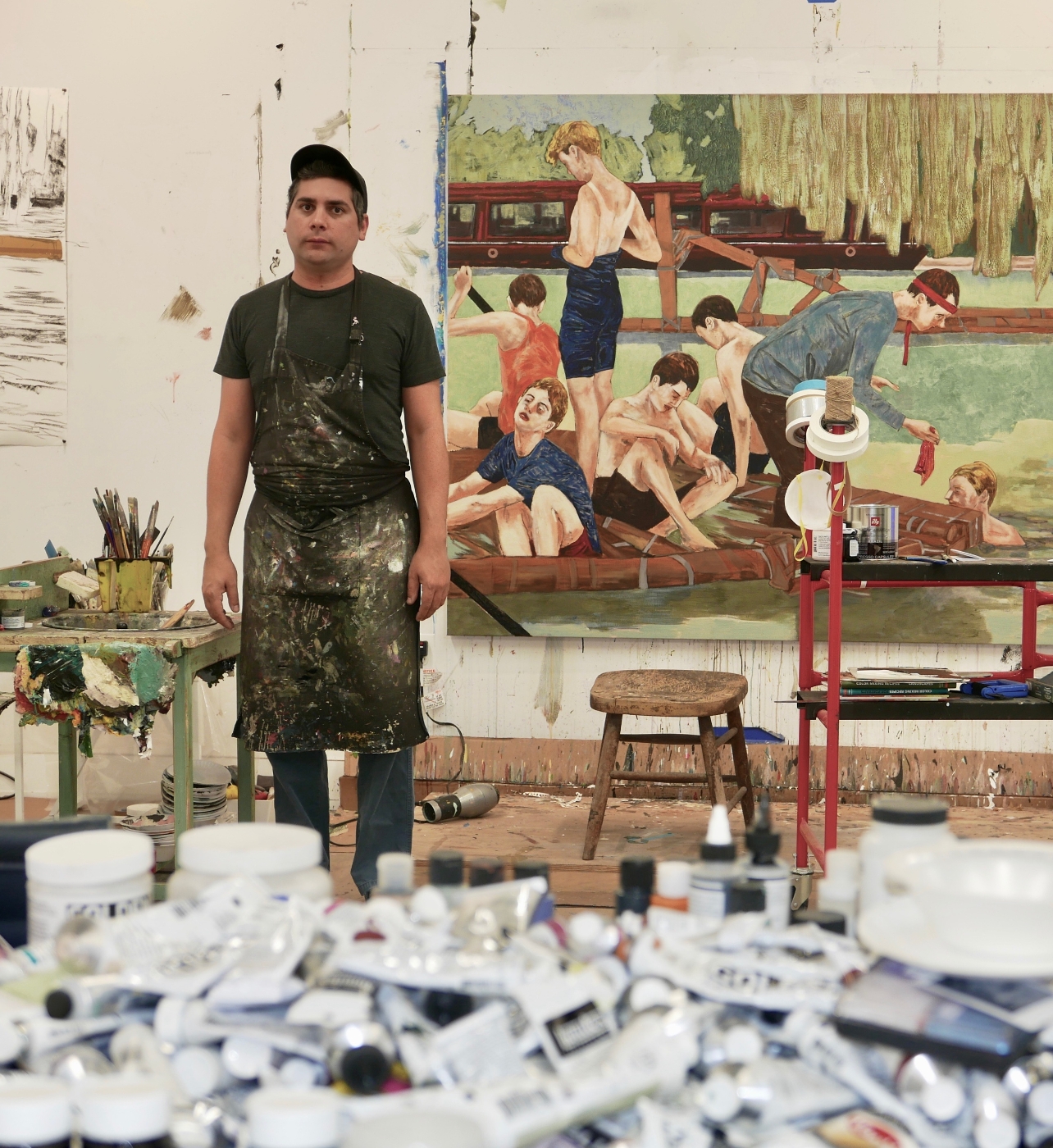 Hernan Bas standing inside his studio