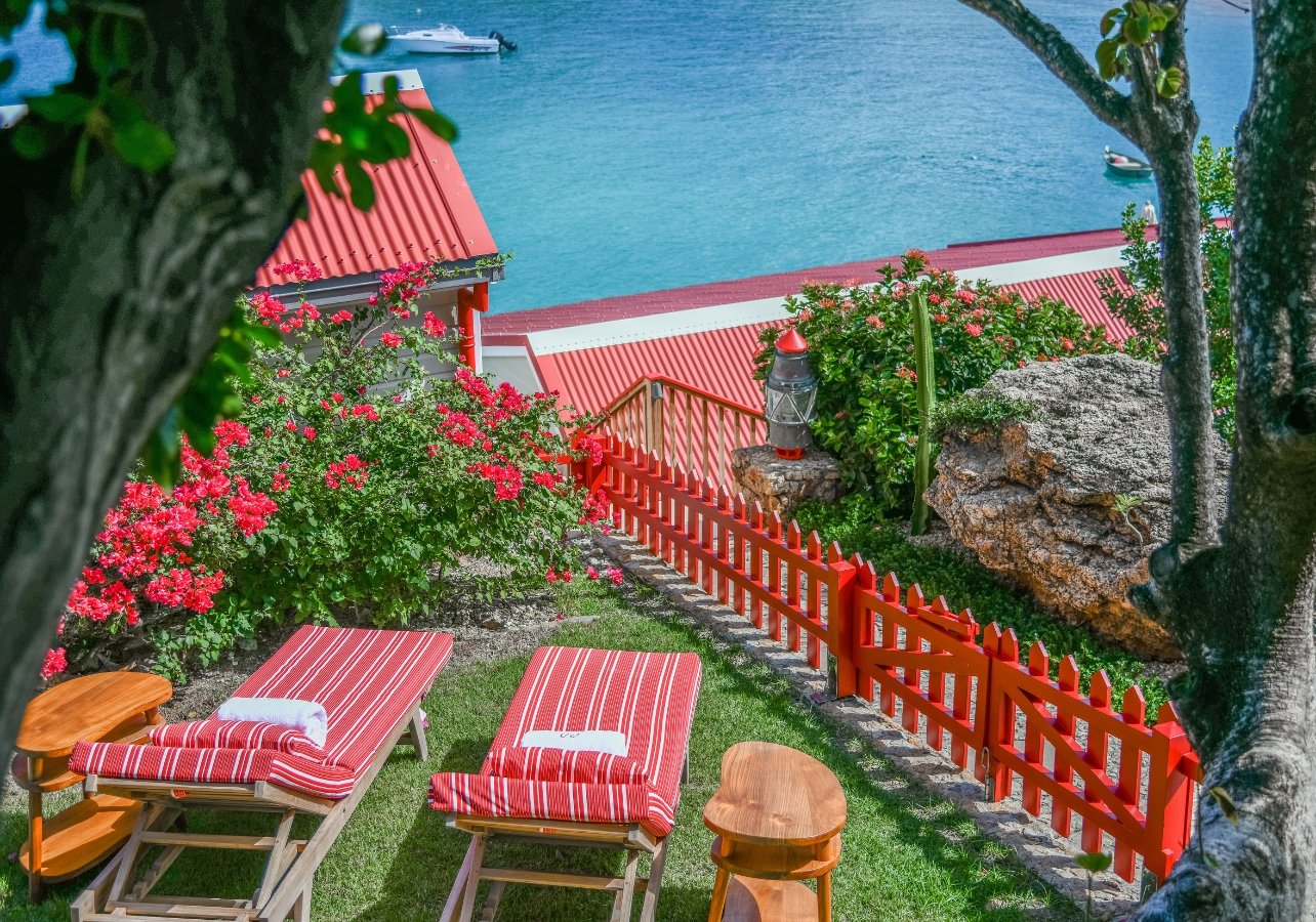 View from the balcony with chairs in the Legacy villa at the Eden Rock in St. Barths