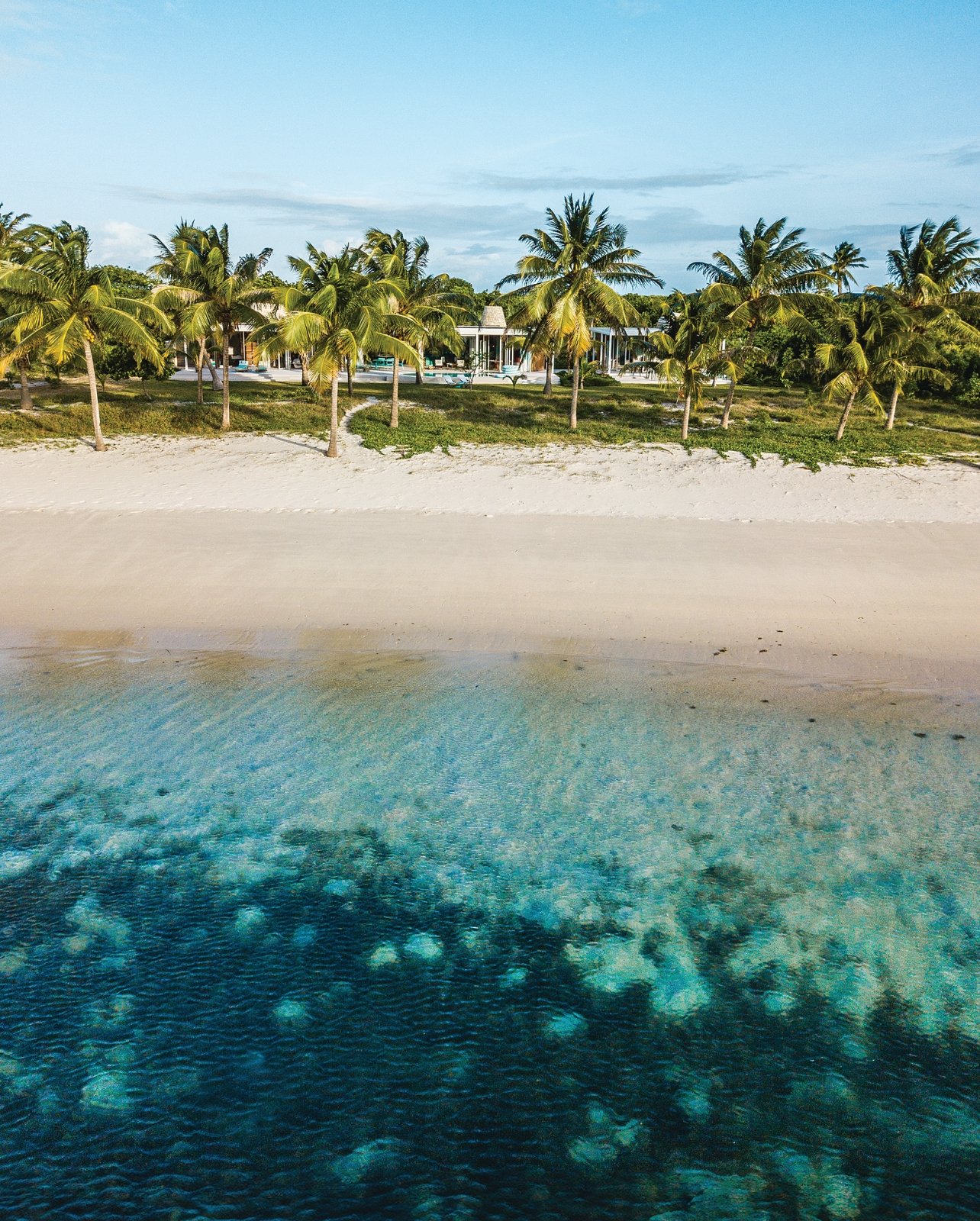 Portrait of the The Miavana Villa beach entrance steps away from the sea