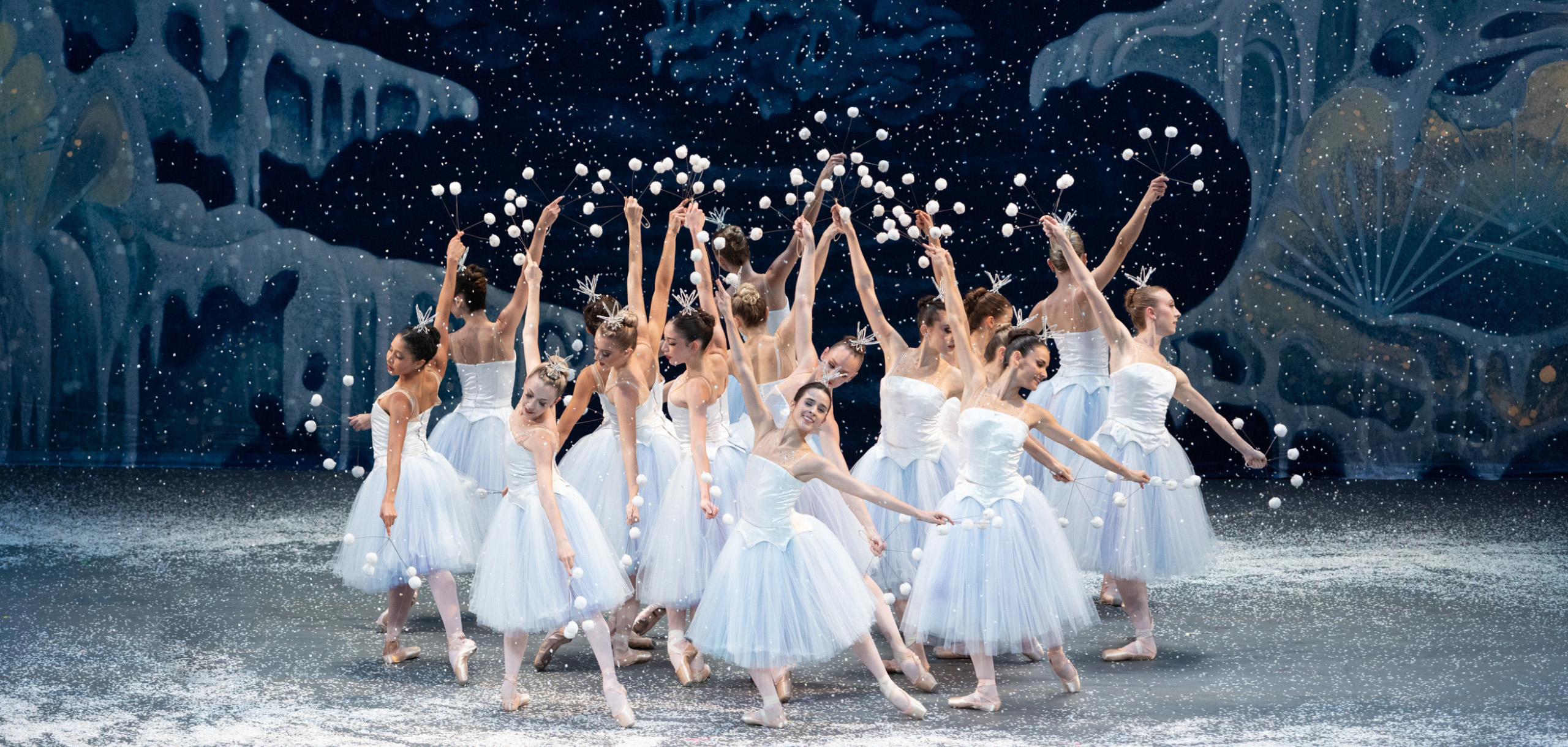 Miami City Ballet’s dancers in white tutus performing in George Balanchine’s The Nutcracker®