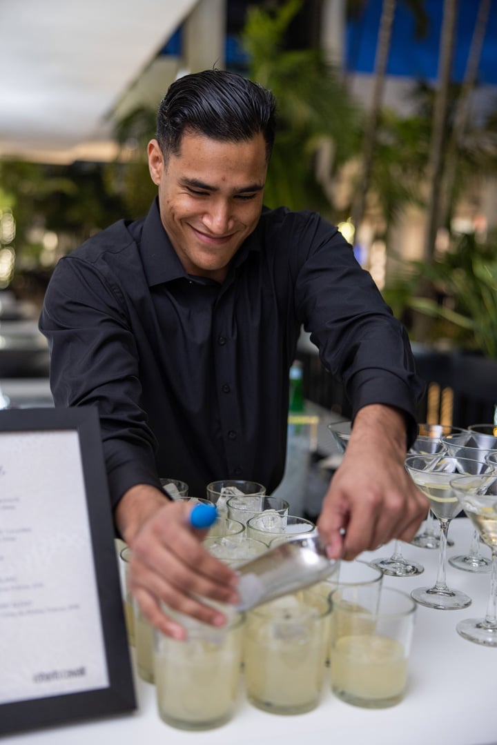 Bartender preparing Makoto cocktails for guests