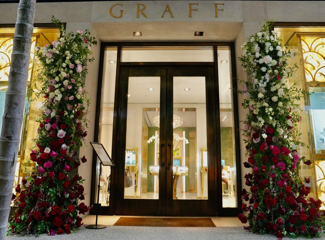 Entrance to the Graff boutique adorned with multicolored rose arrangements