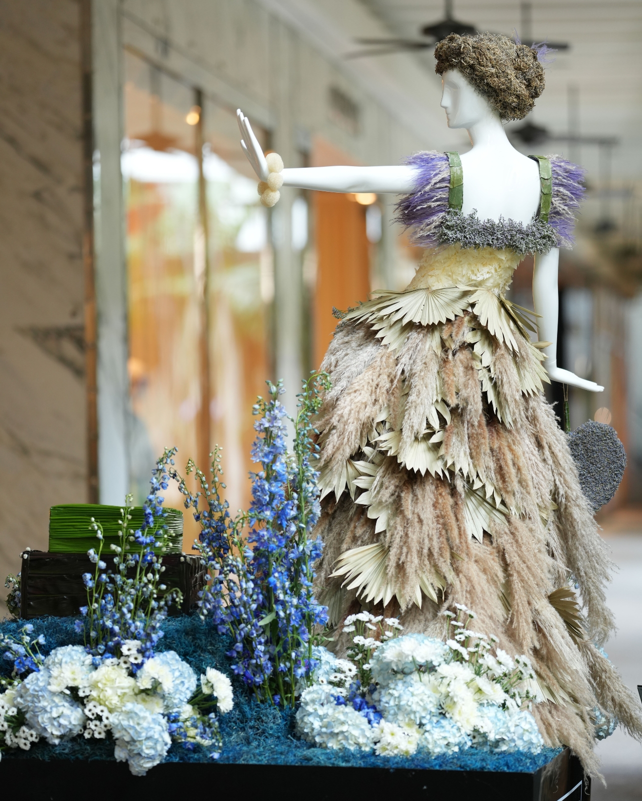 Floral mannequin with palm leaf dress at Bal Harbour Shops