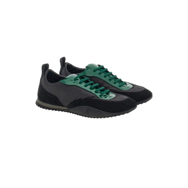 Black patent leather sneaker with green laces
