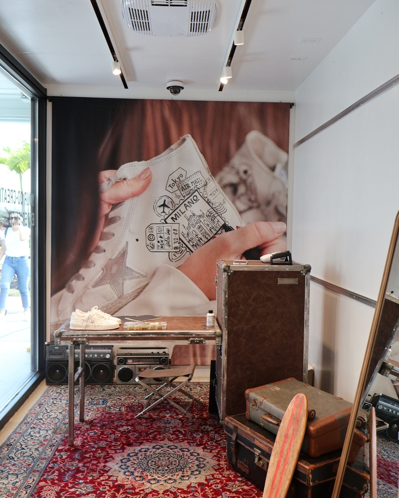 Portrait of the interior of the temporary Golden Goose storefront at Bal Harbour Shops