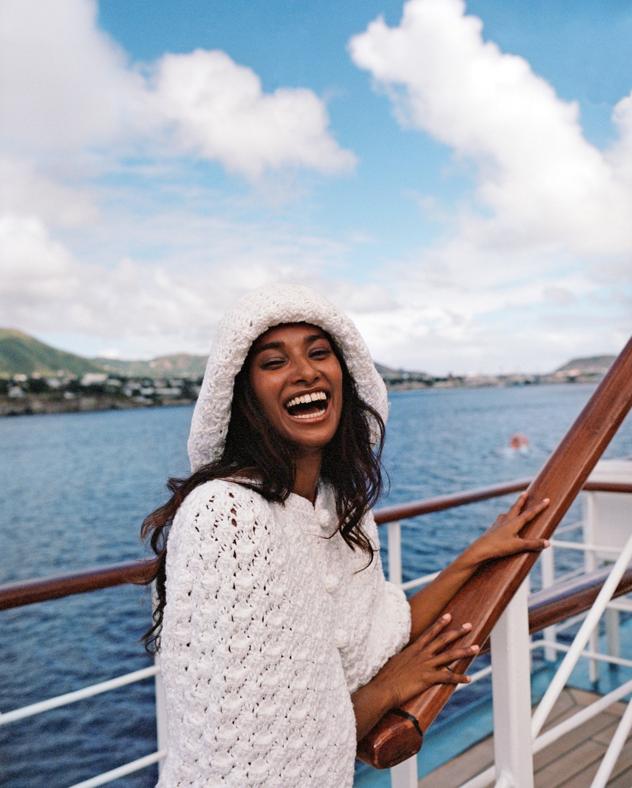 Nidhi Sunil posing in Loro Piana hat, cape, and skirt