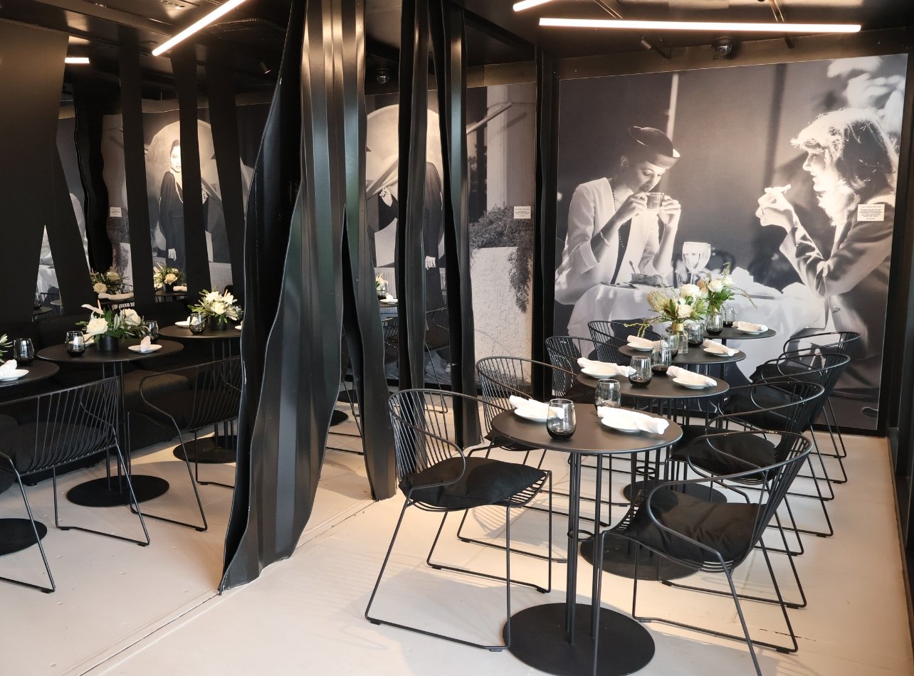 Portrait of the interior dining area in The Whitman restaurant at the Bal Harbour Shops pop-up