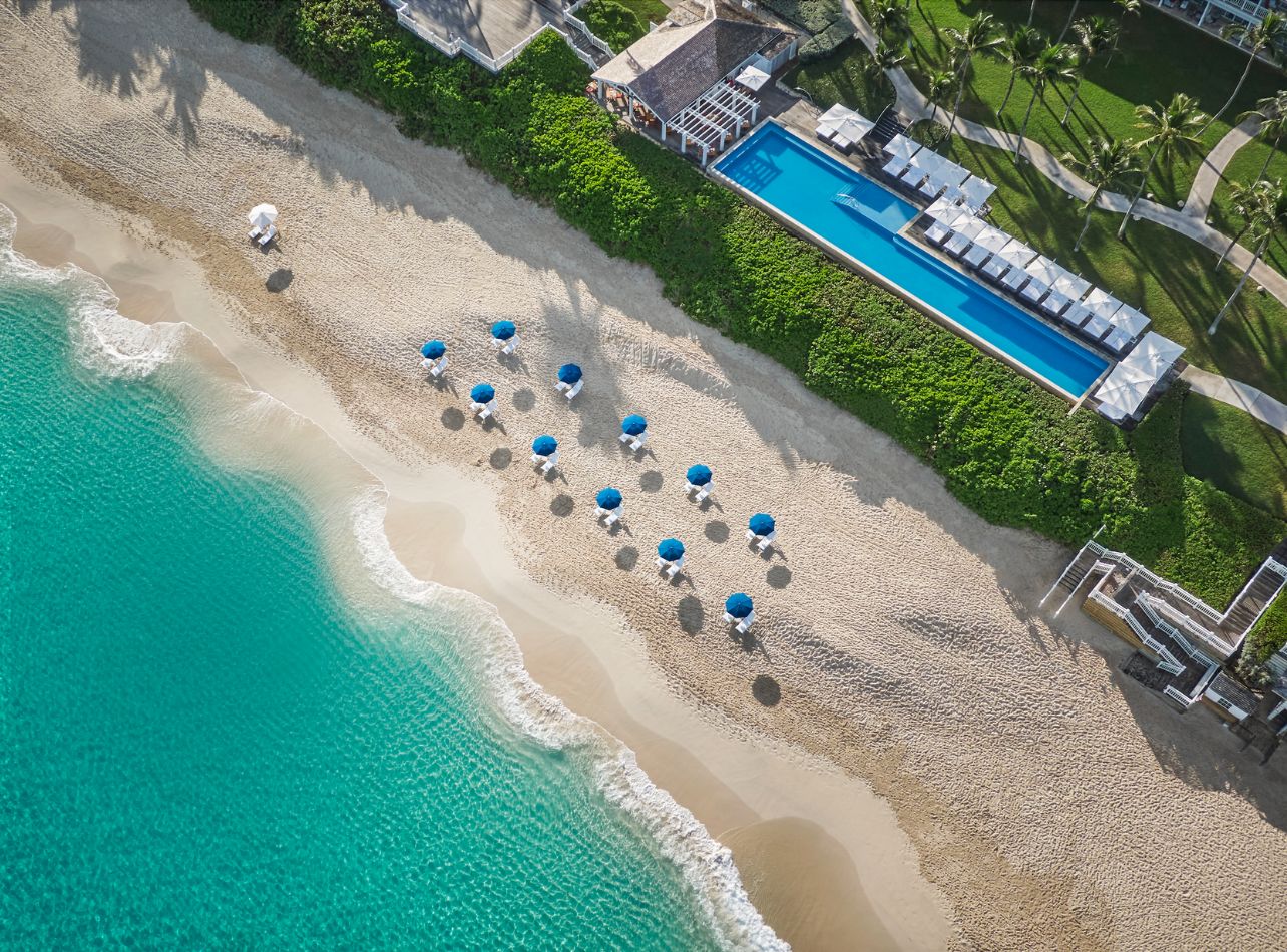 Four Seasons Aerial shot of Beach with Umbrellas, lounge chairs and pool views