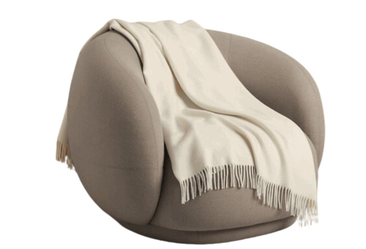 Frette cream cashmere throw on couch