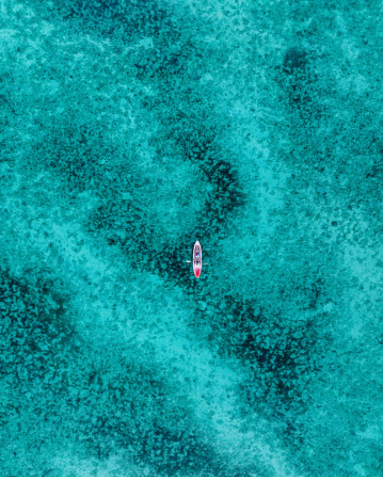 Aerial view of The Coast of Nassau, New Providence, Bahamas, with a Kayak