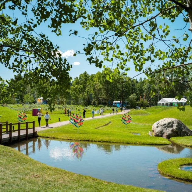 Grounds of the Aspen Ideas Festival with greenery a lake and event setup