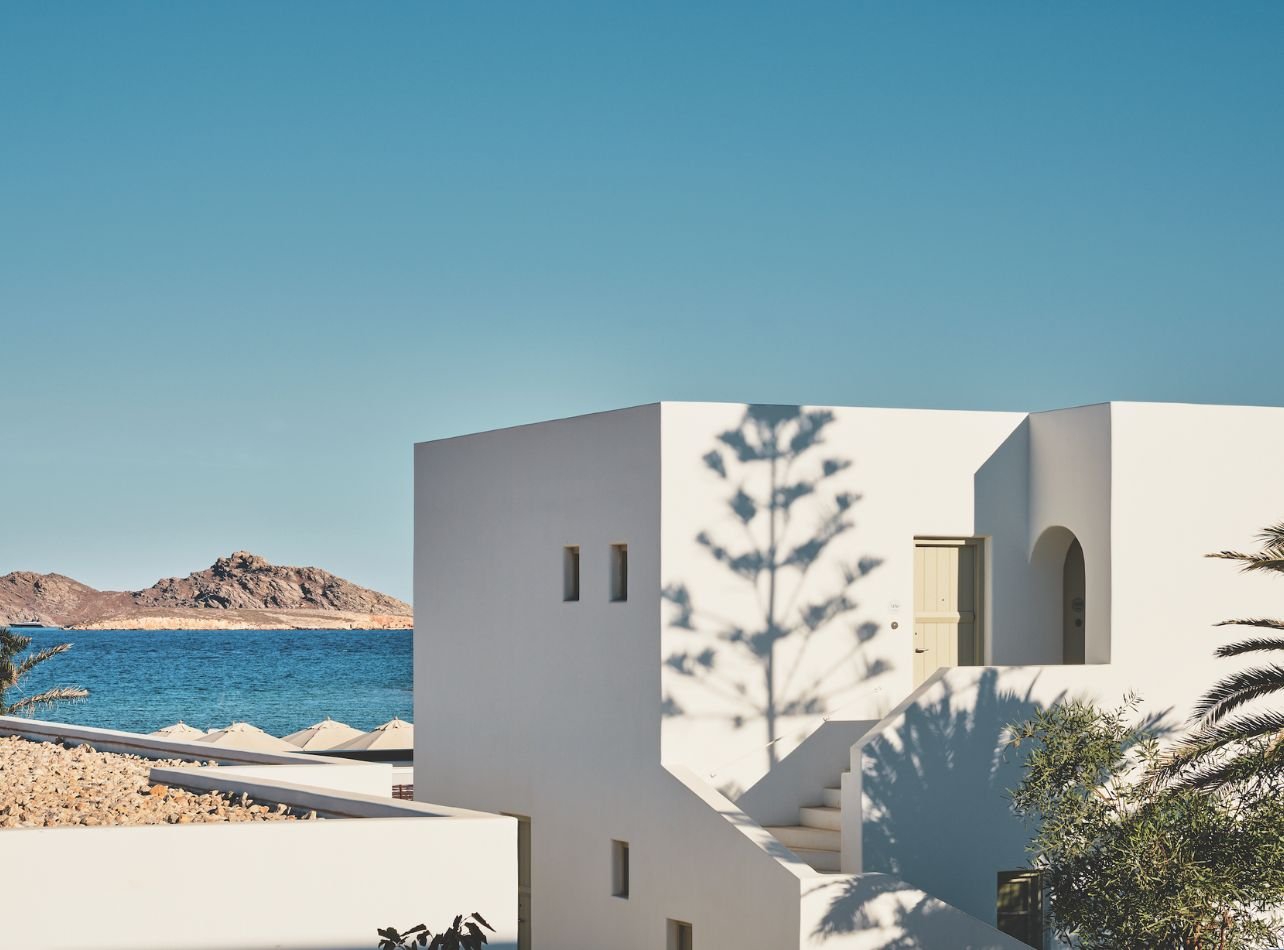 Cosme Resort white building with sea view
