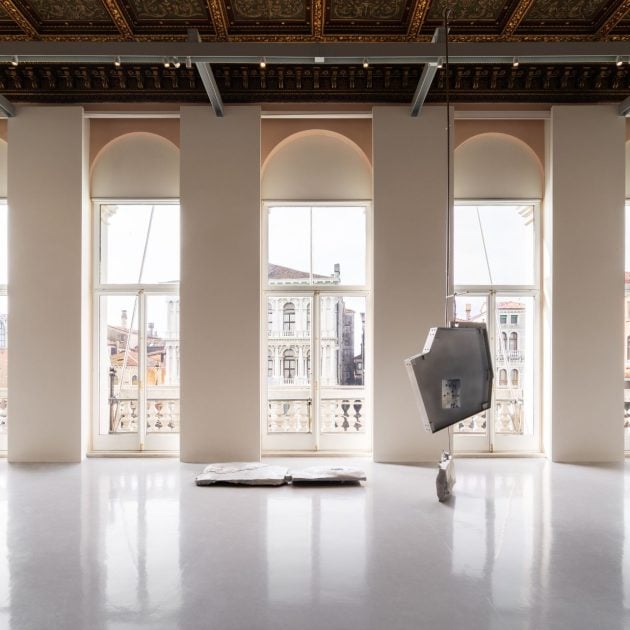 Room with view of a large art piece with 3 arched glass windows