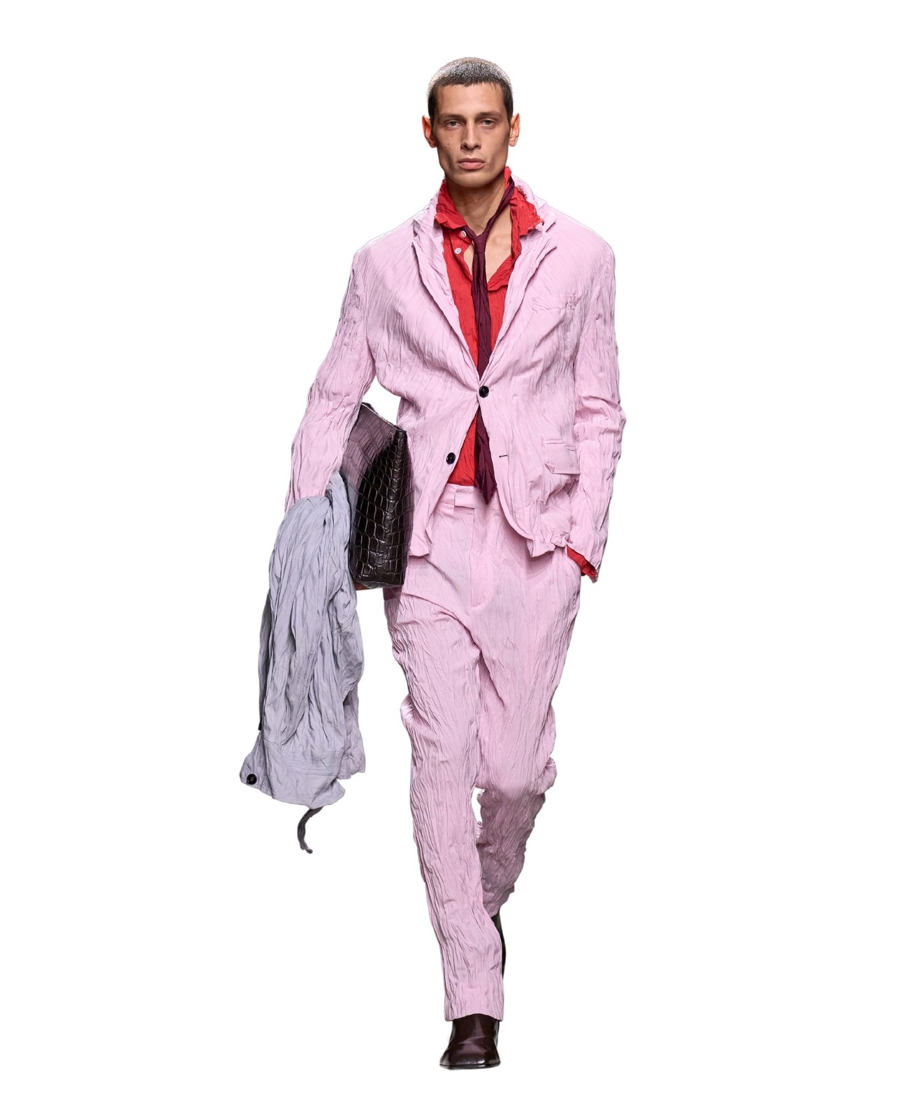 Bottega Veneta model wearing a matching light pink blazer and pant set