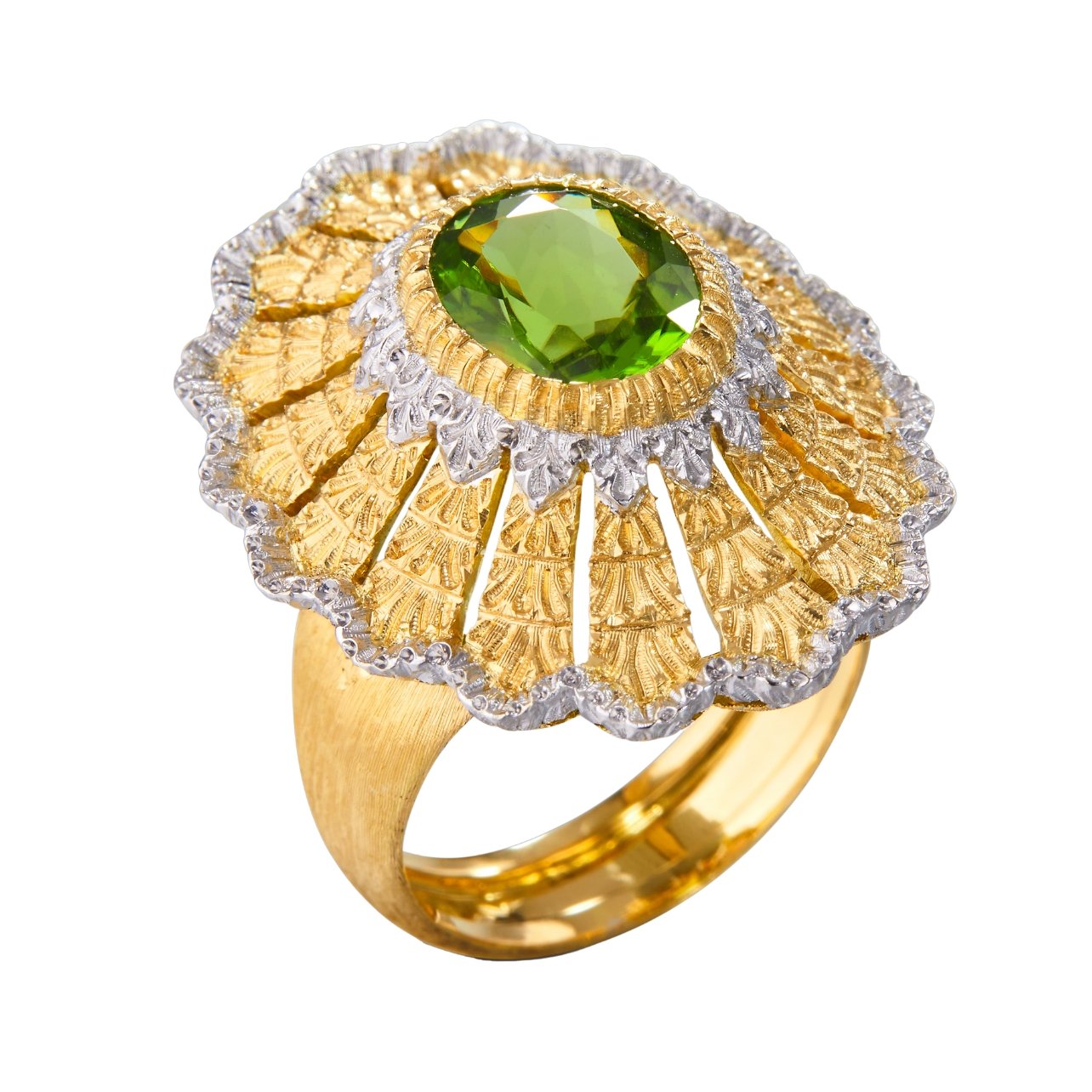 Buccellati ring in yellow and white gold with a peridot in the center